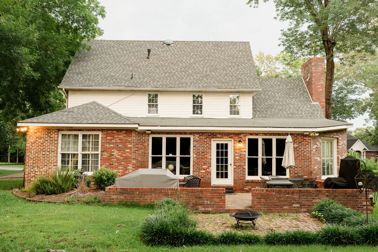 Exterior view of a brick ranch-style home with white trim and landscaping, shown from multiple angles.