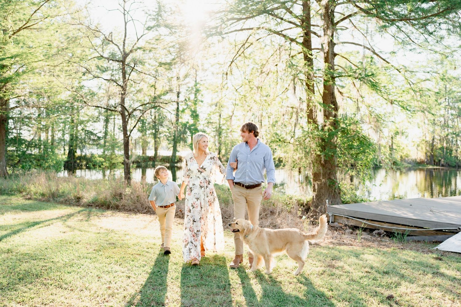 Family portraits taken outdoors in a wooded setting with warm natural lighting.