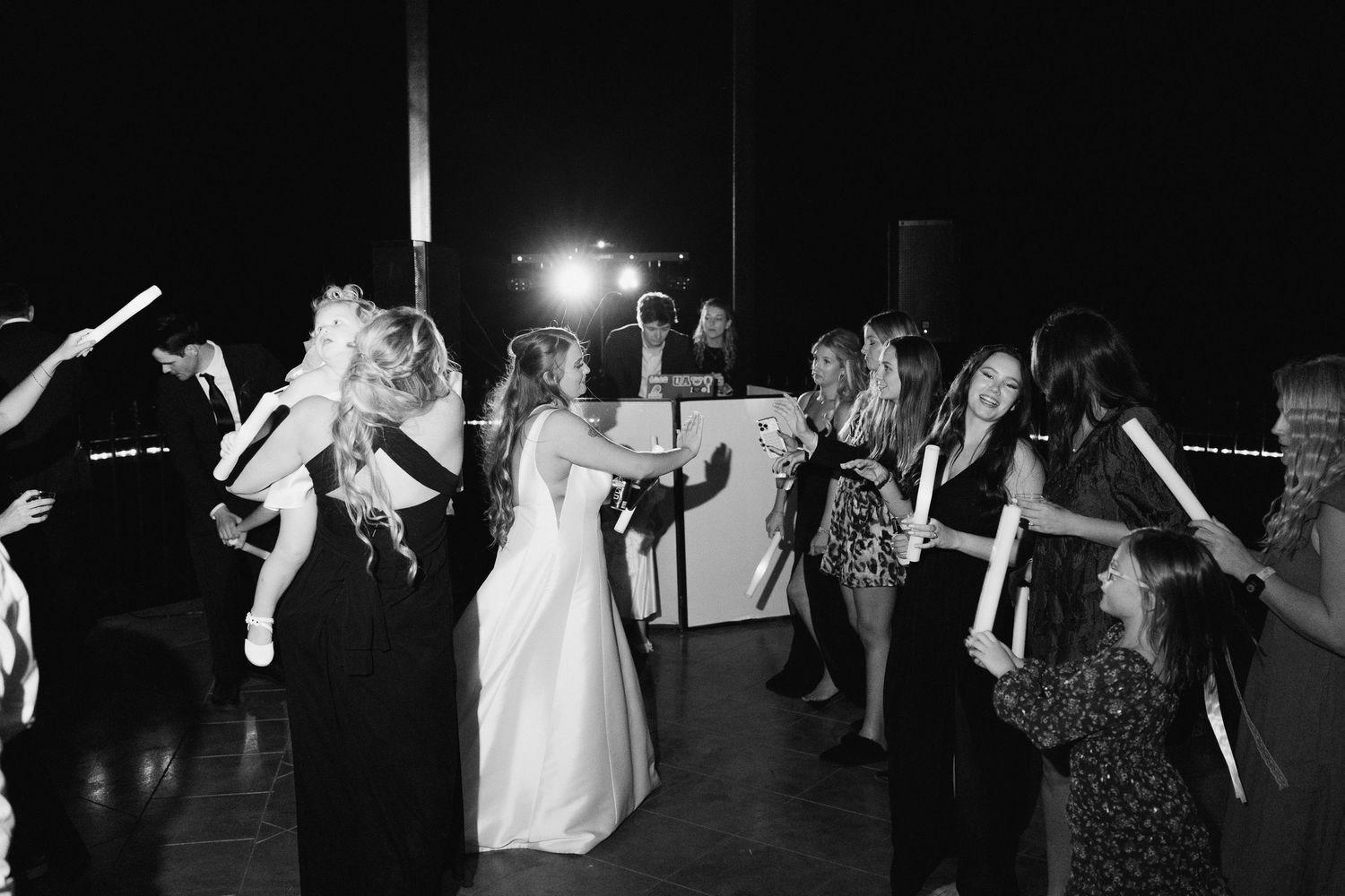 Black and white shots of wedding reception dance floor celebrations.
