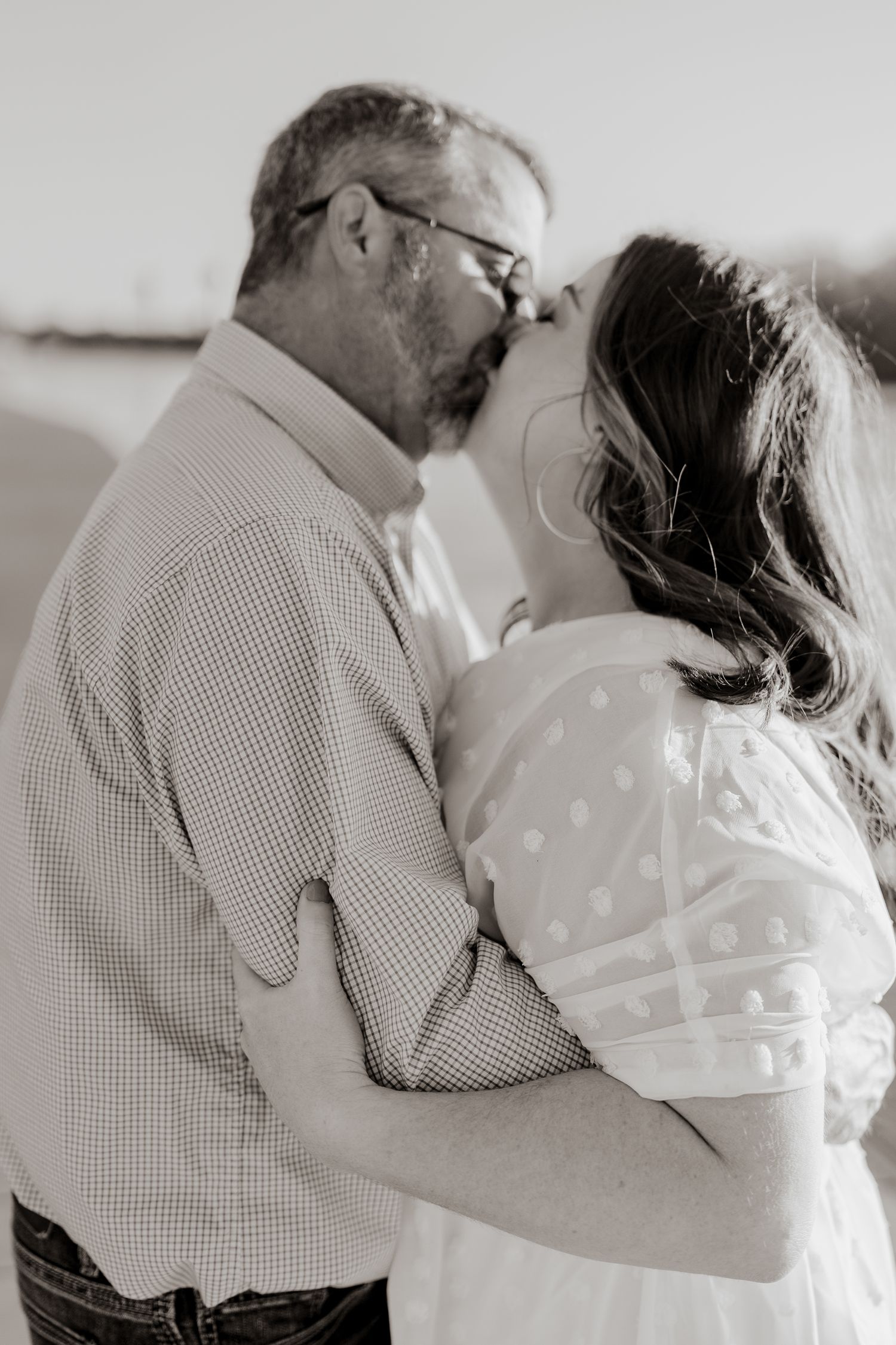 Intimate black and white photo series capturing romantic couple's tender moments.