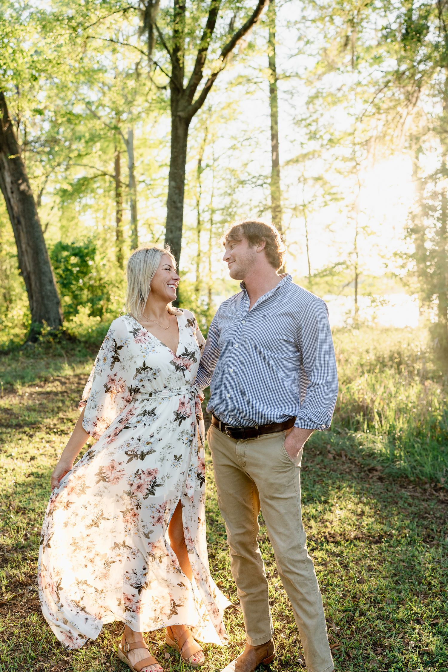 A romantic forest photoshoot with sunlight streaming through the trees.