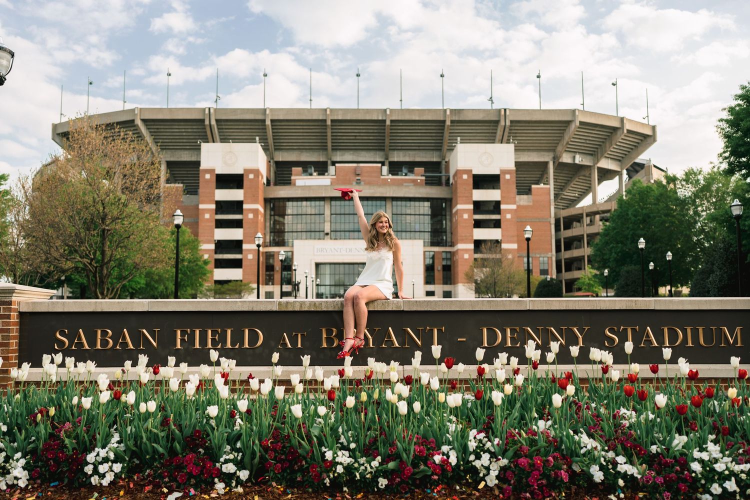 A panoramic view of Bryant-Denny Stadium at the University of Alabama with its iconic brick exterior and signage.