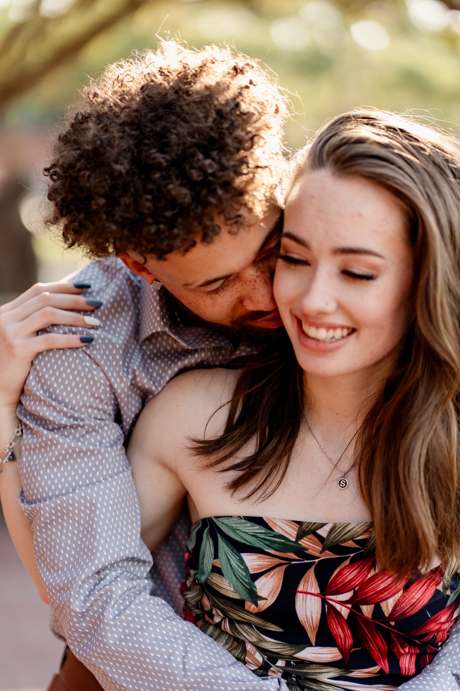 A romantic couple portrait session with genuine laughter and joy.