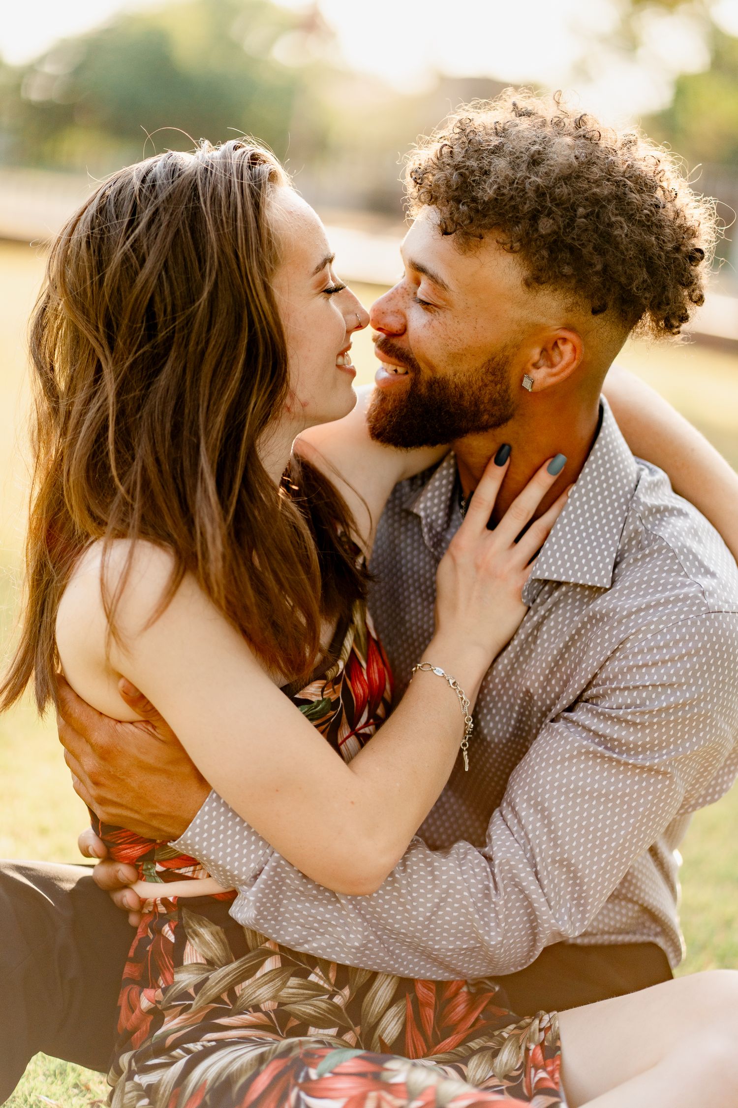 A couple shares romantic close-up moments during sunset photography.