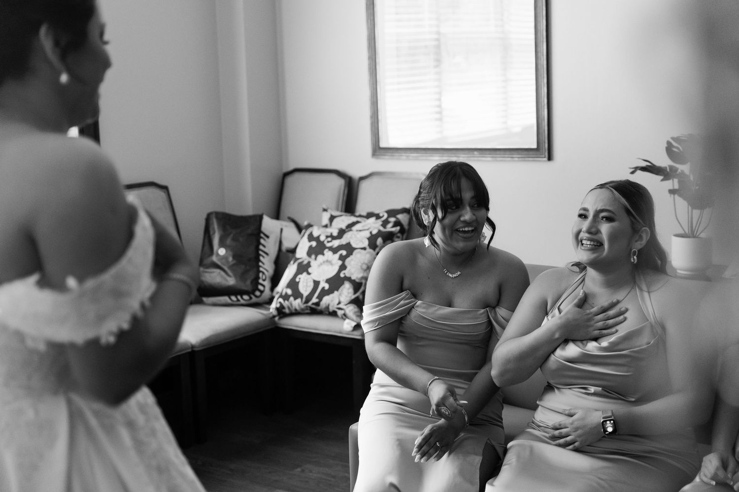 A series of black and white photos showing tender moments between people in casual indoor settings.