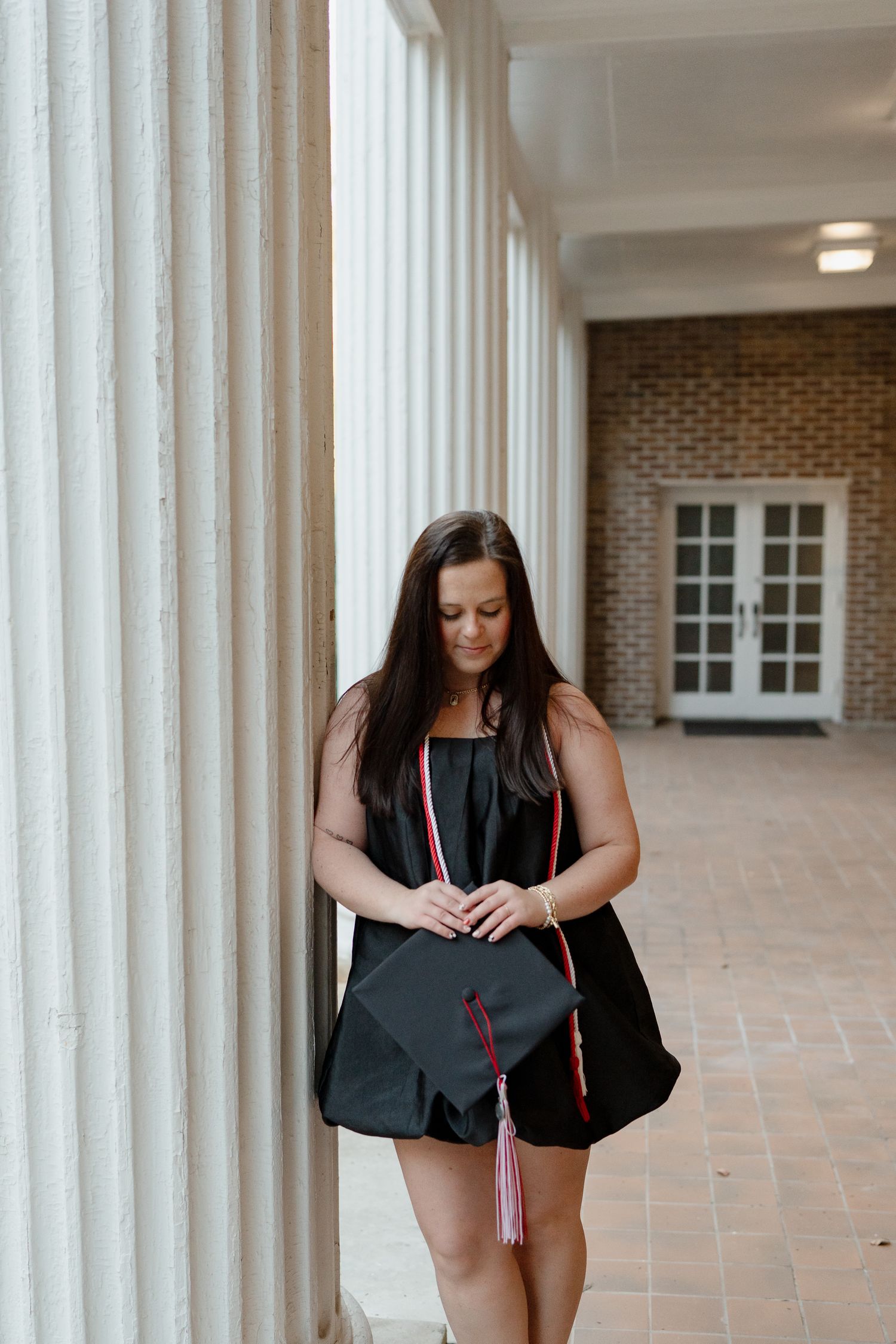 A graduation photoshoot sequence shows a person in black dress and pink stole checking their bag on a columned porch.