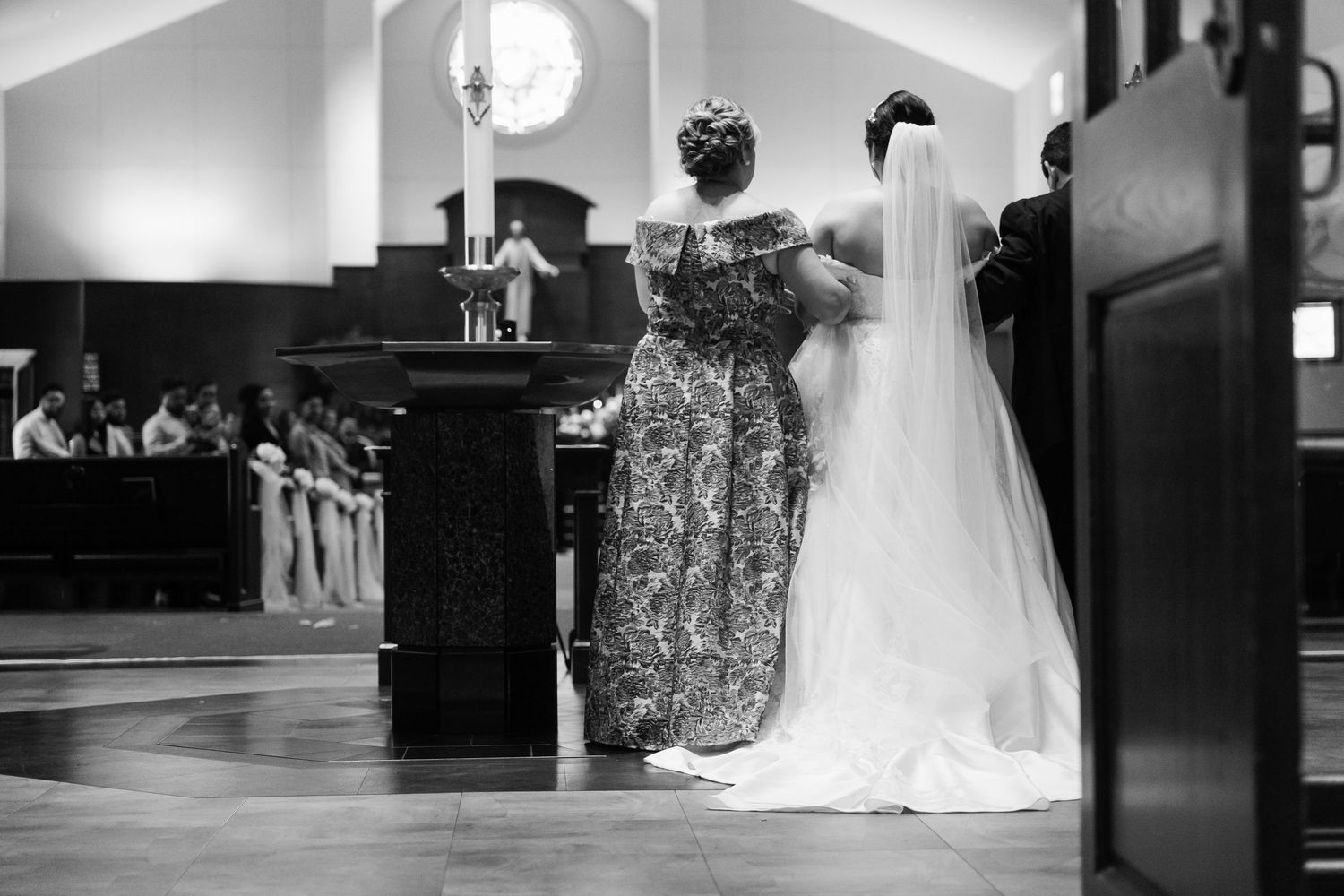 A series of black and white wedding photos showing couples dancing and celebrating at an elegant reception venue.