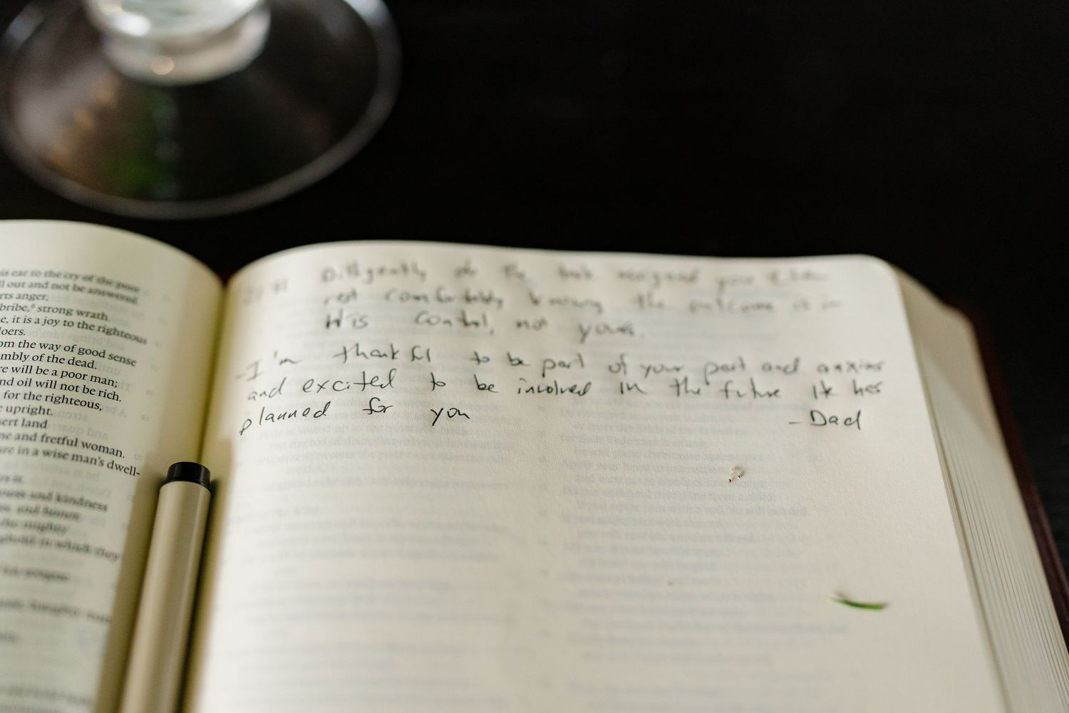 A collection of open books with handwritten notes and text spread across multiple pages in a row.