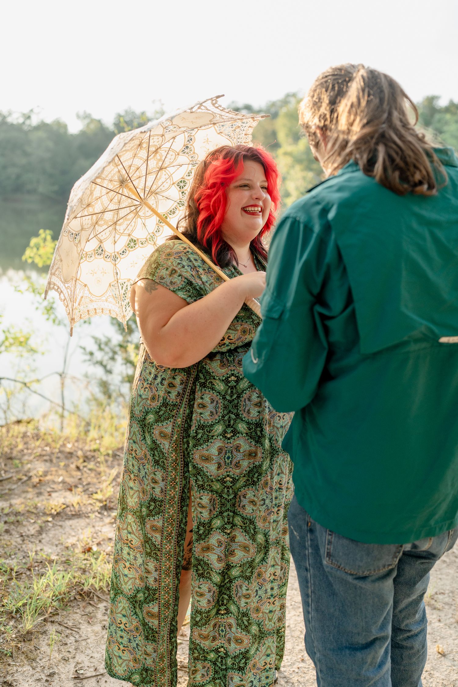 A series of whimsical poses with a lace parasol against a natural outdoor backdrop.