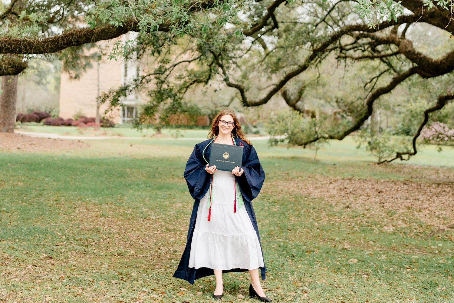 Sprawling oak trees create natural canopy over campus grounds.