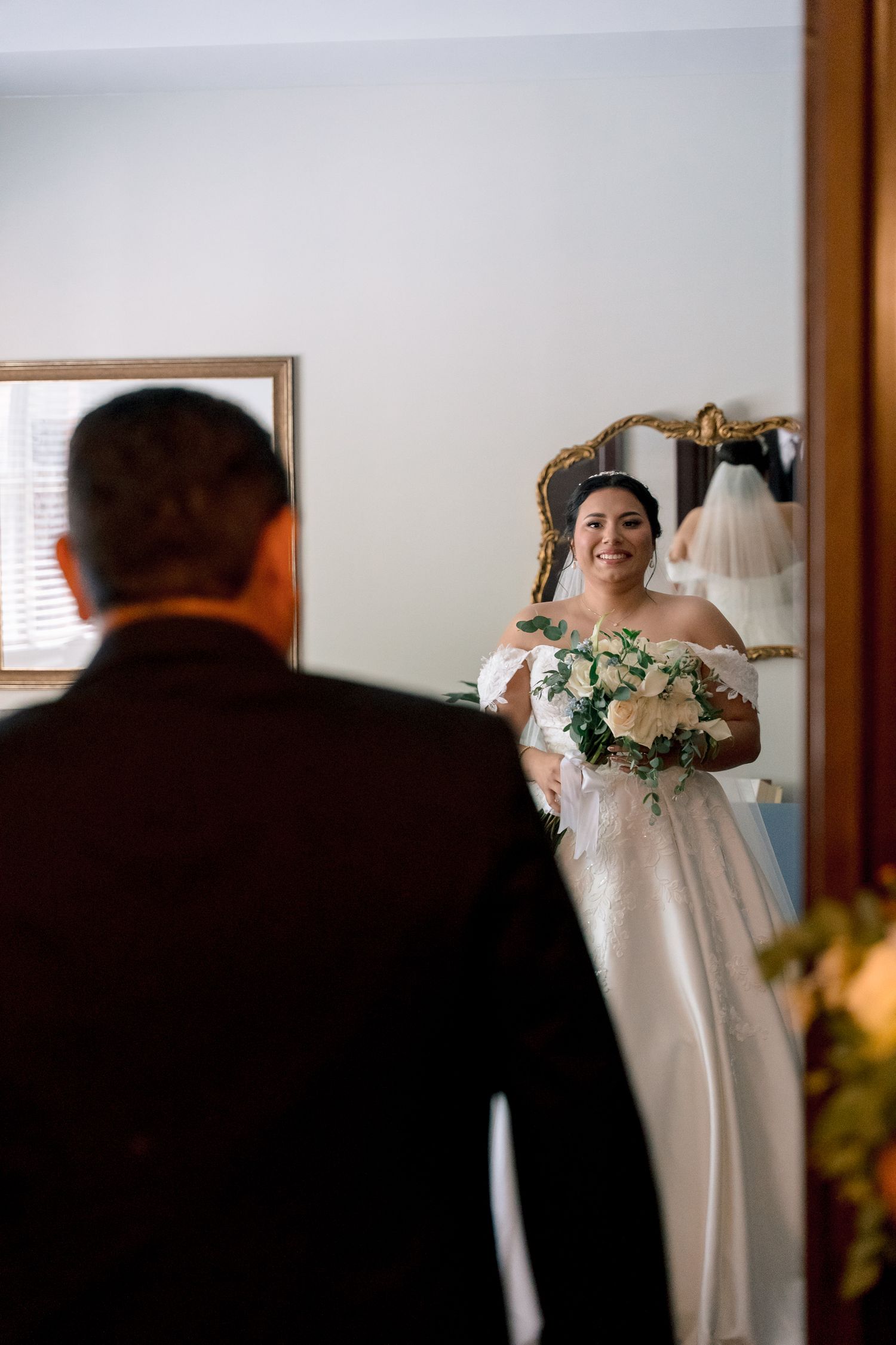 A series of mirror reflections show a bride getting ready for her wedding with delicate floral details.