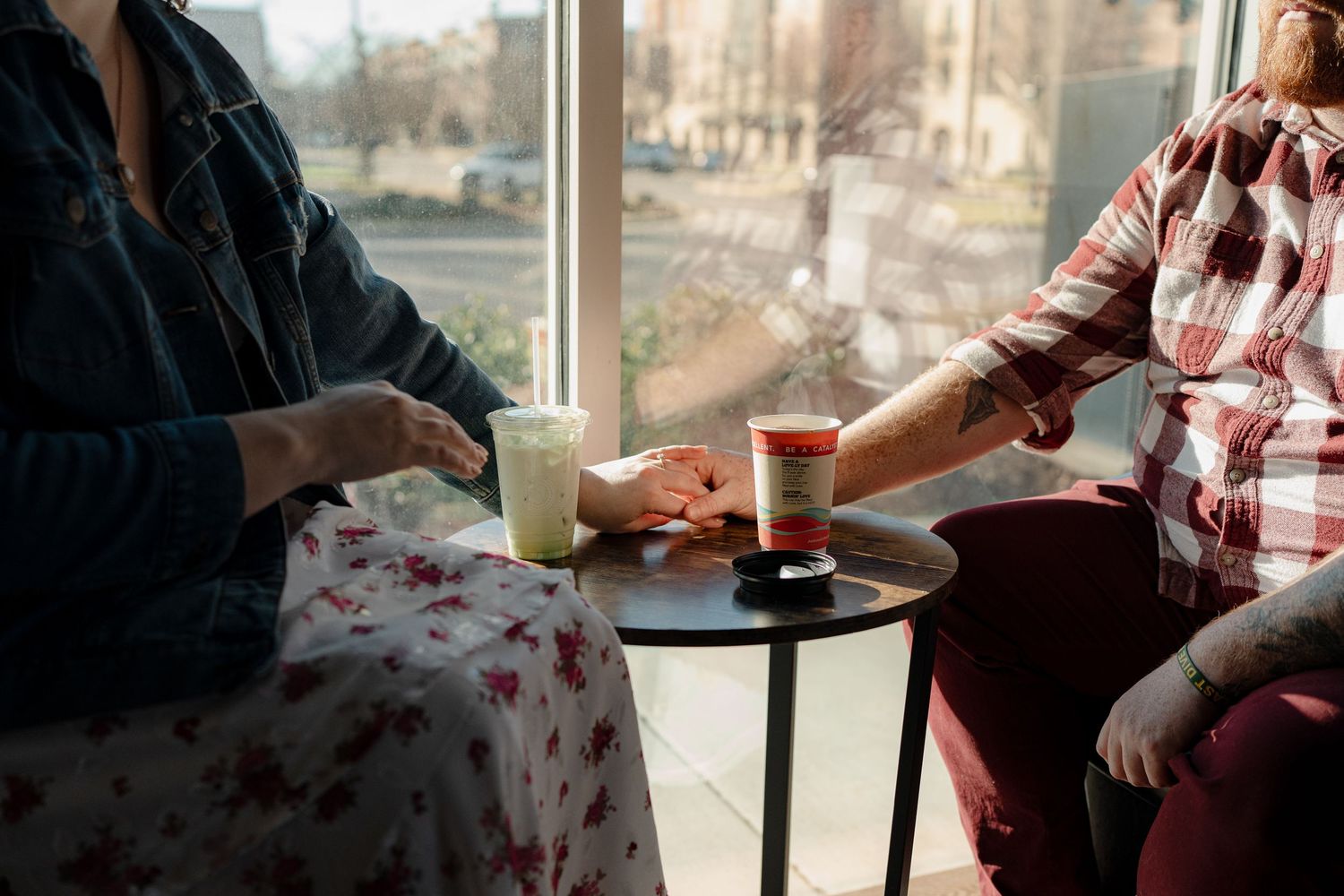 A series of cafe scenes showing two people engaged in animated conversation by sunlit windows.