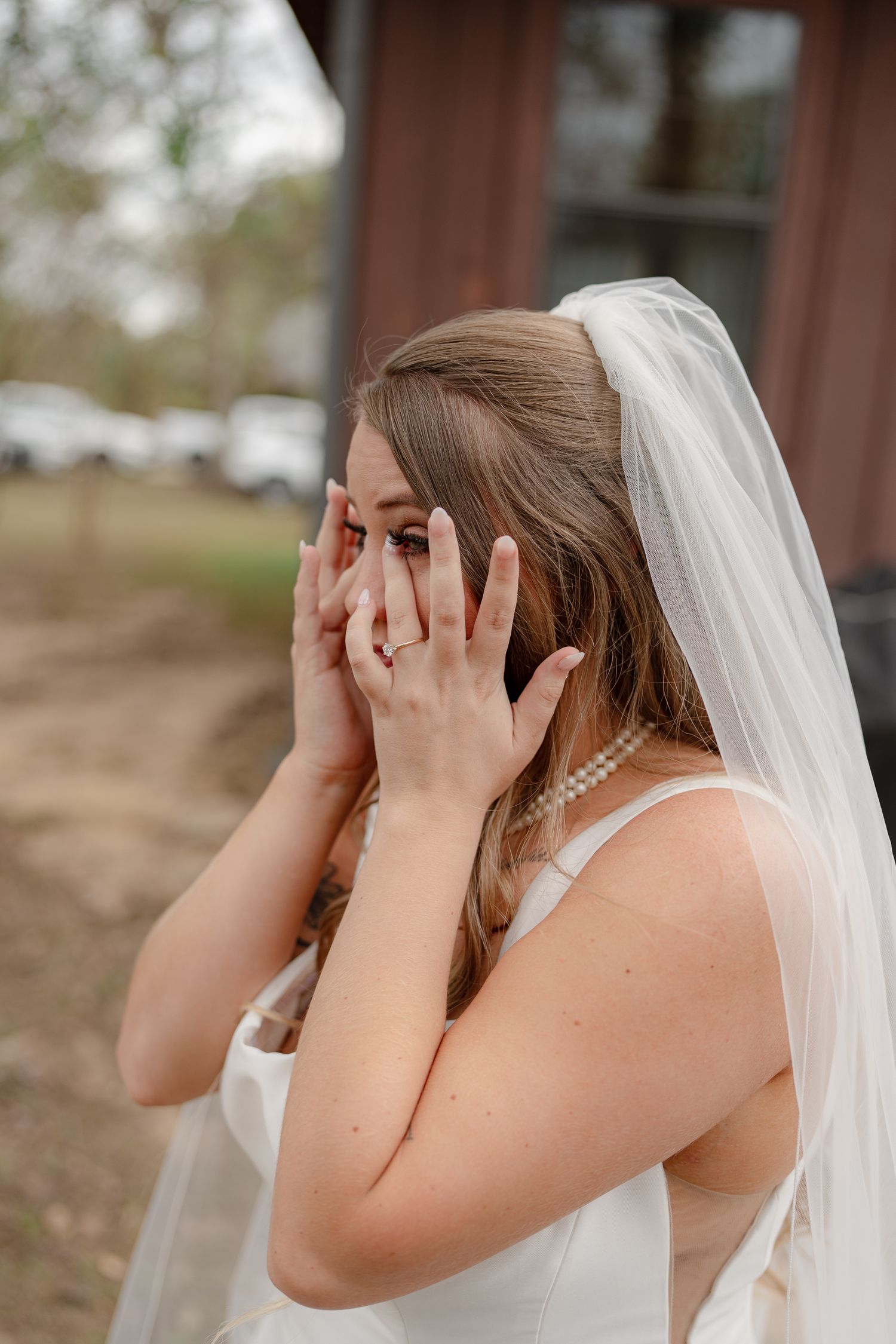 A bride in a white wedding dress and veil covers her face with her hands in a playful sequence of photos.
