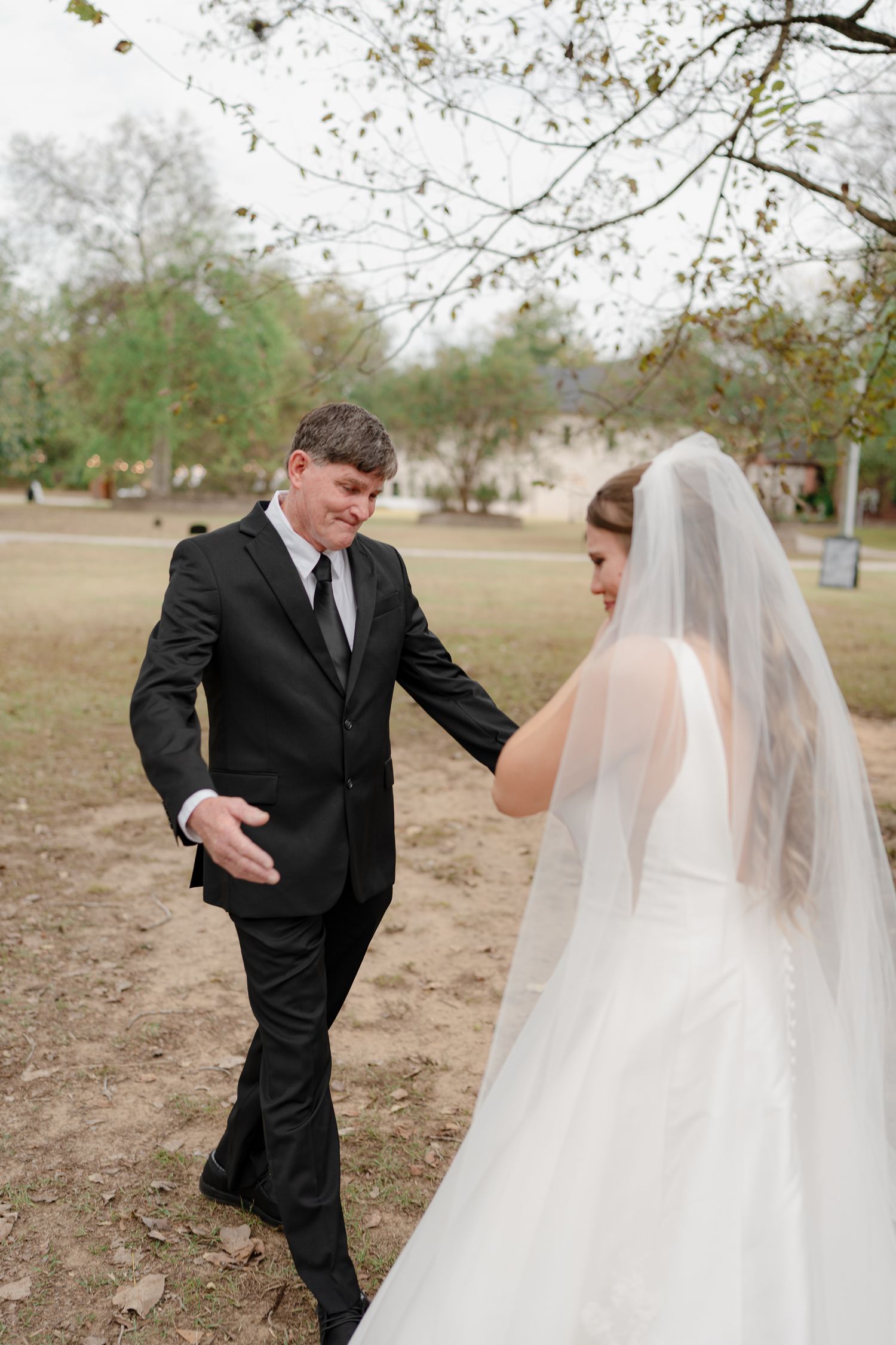 A sequence of first look photos capturing a touching wedding moment in an outdoor setting.