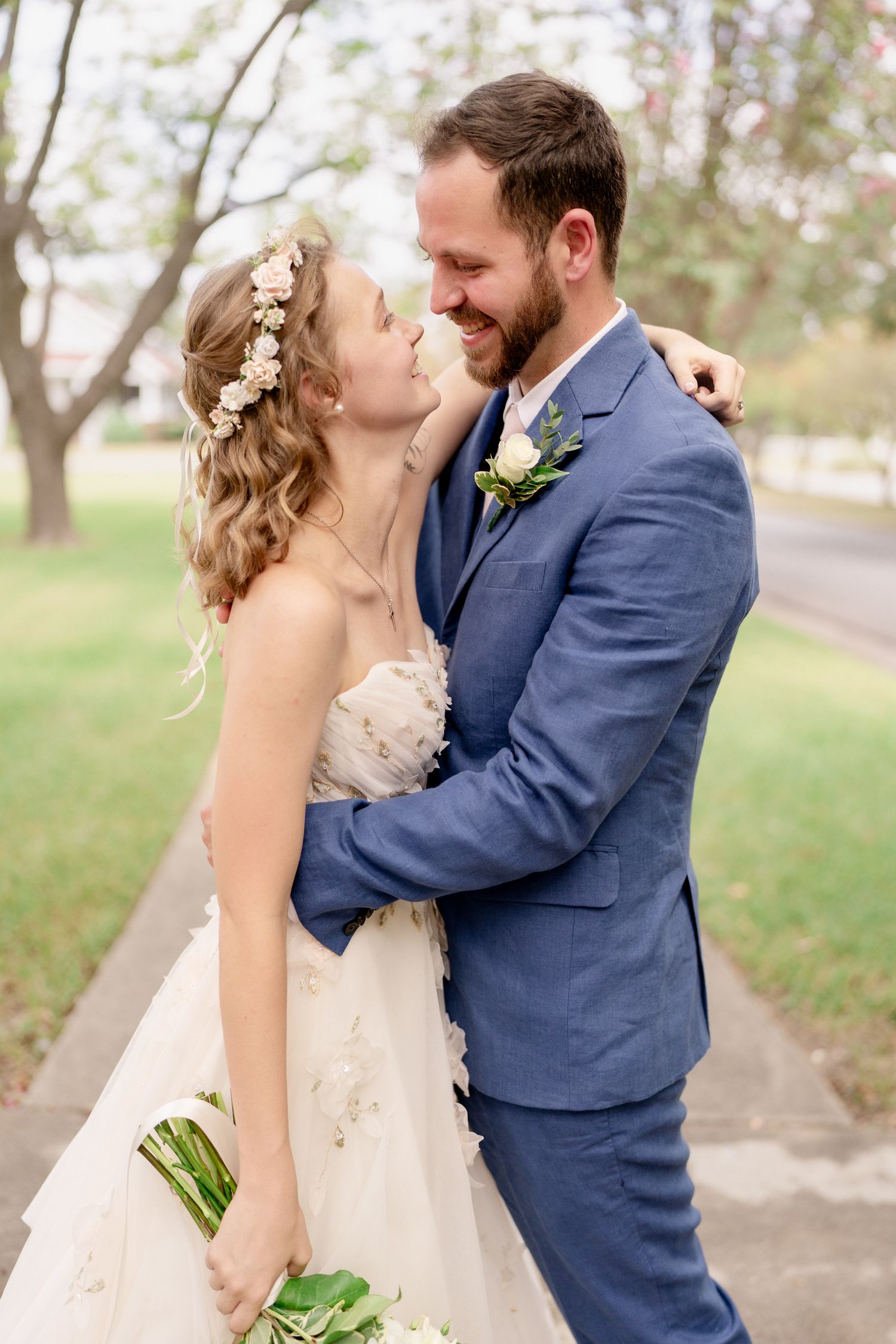 A romantic wedding photo sequence showing a couple in navy suit and white dress sharing tender moments outdoors.