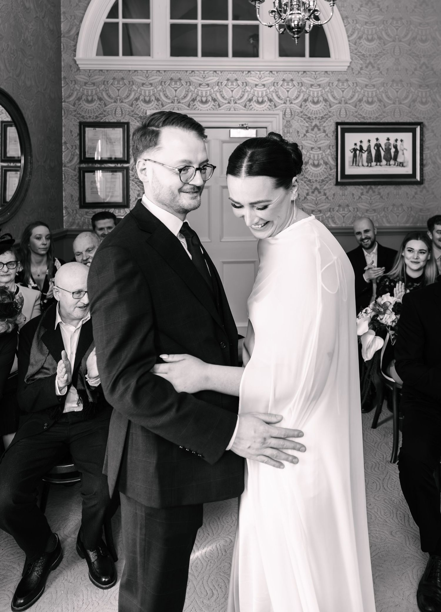 Bath WeddingA black and white photo series showing a couple's first dance at their wedding reception with guests watching in the background.