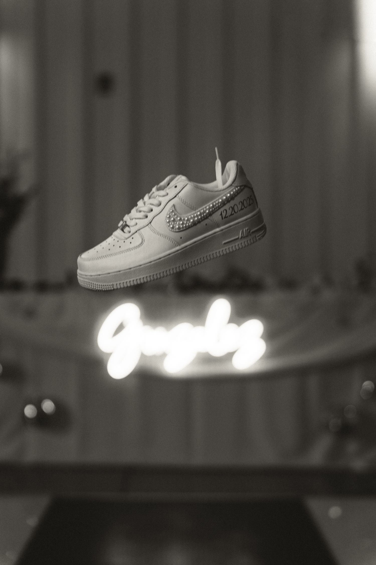 shoe falling out of the sky, black and white photo