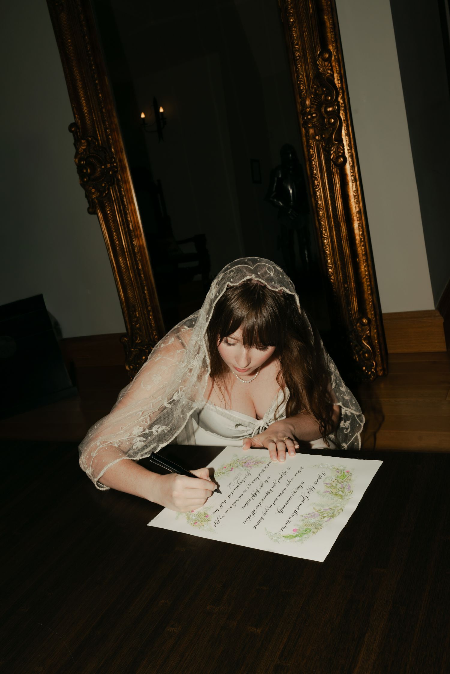 bride signing wedding certificate