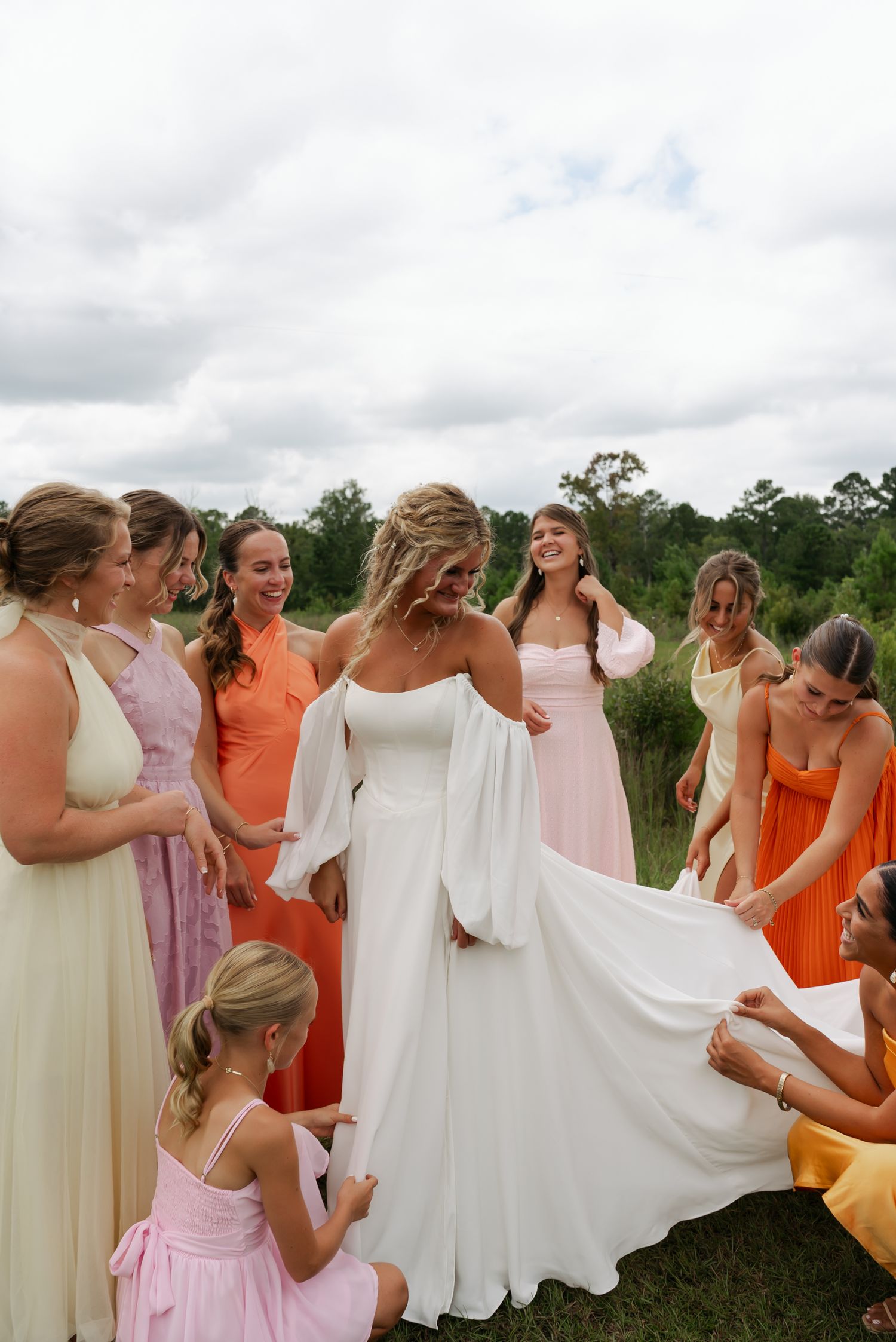 bridesmaid photos, girls are fixing bride's dress