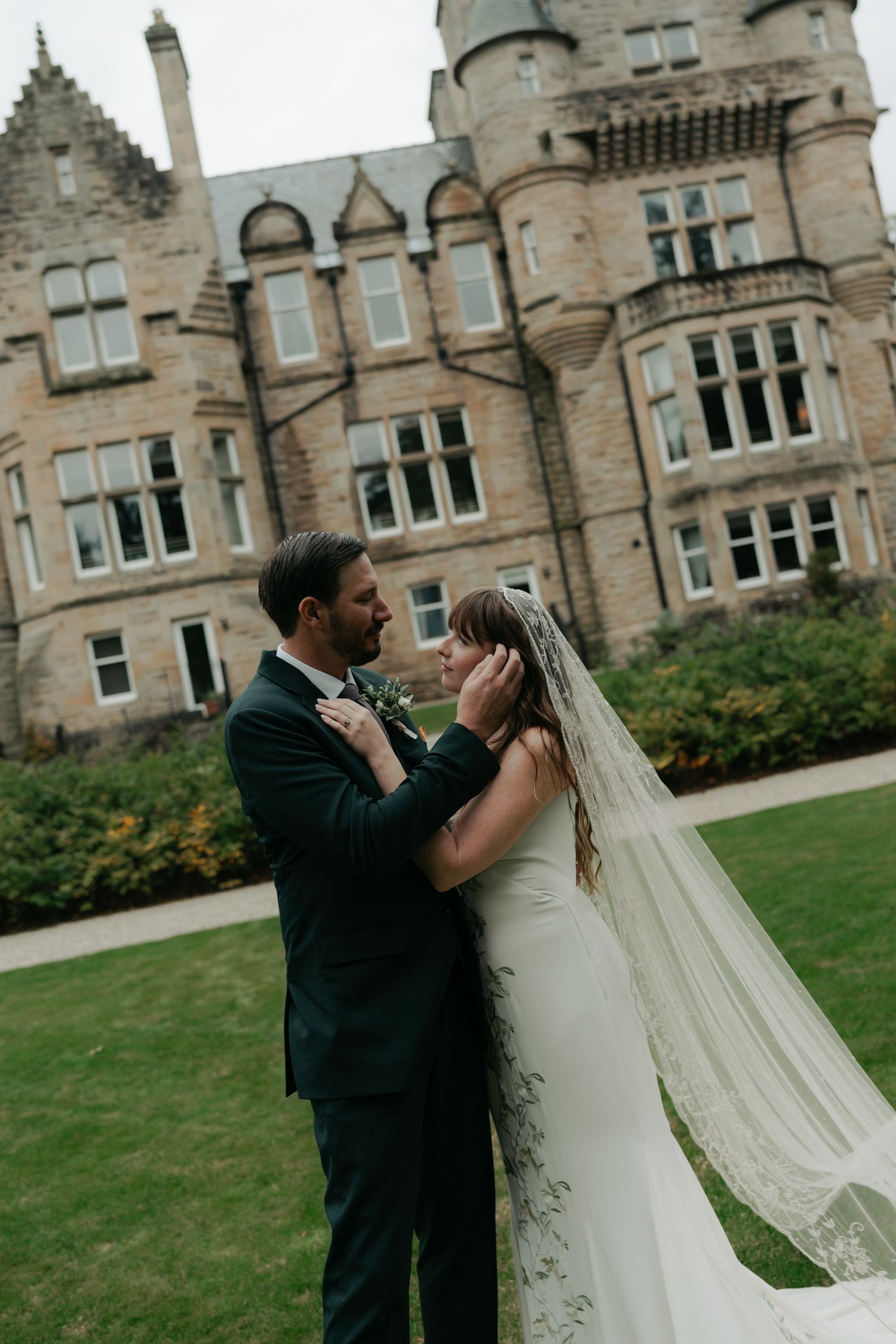 bride and groom standing in a courtyard