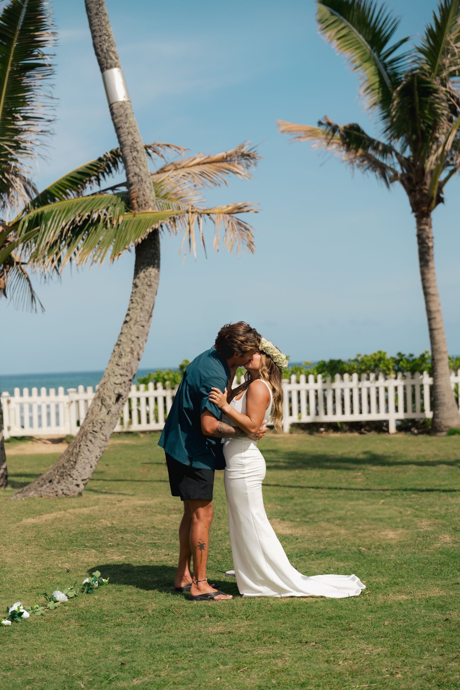 bride and groom kiss during ceremony