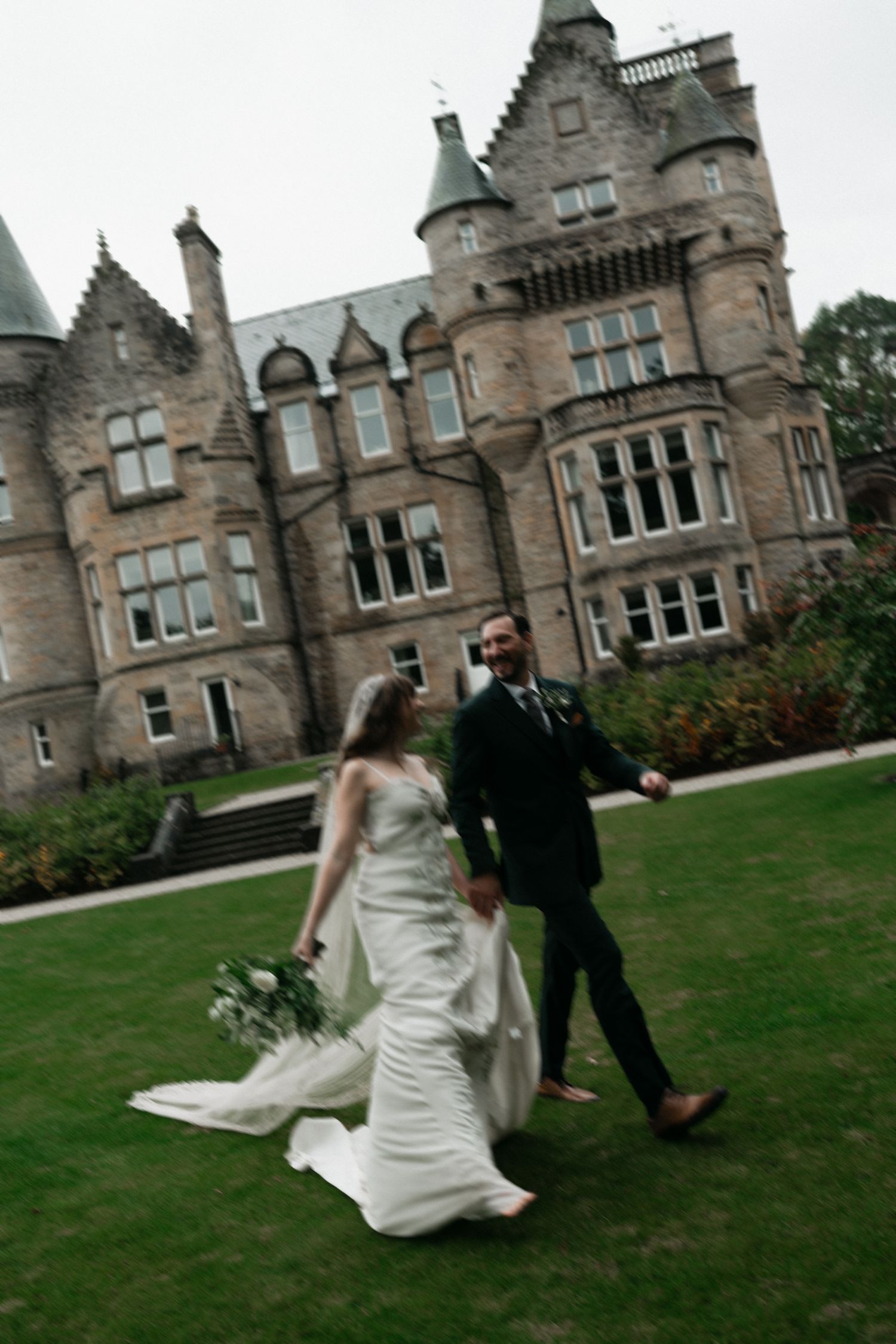 bride and groom standing in a courtyard