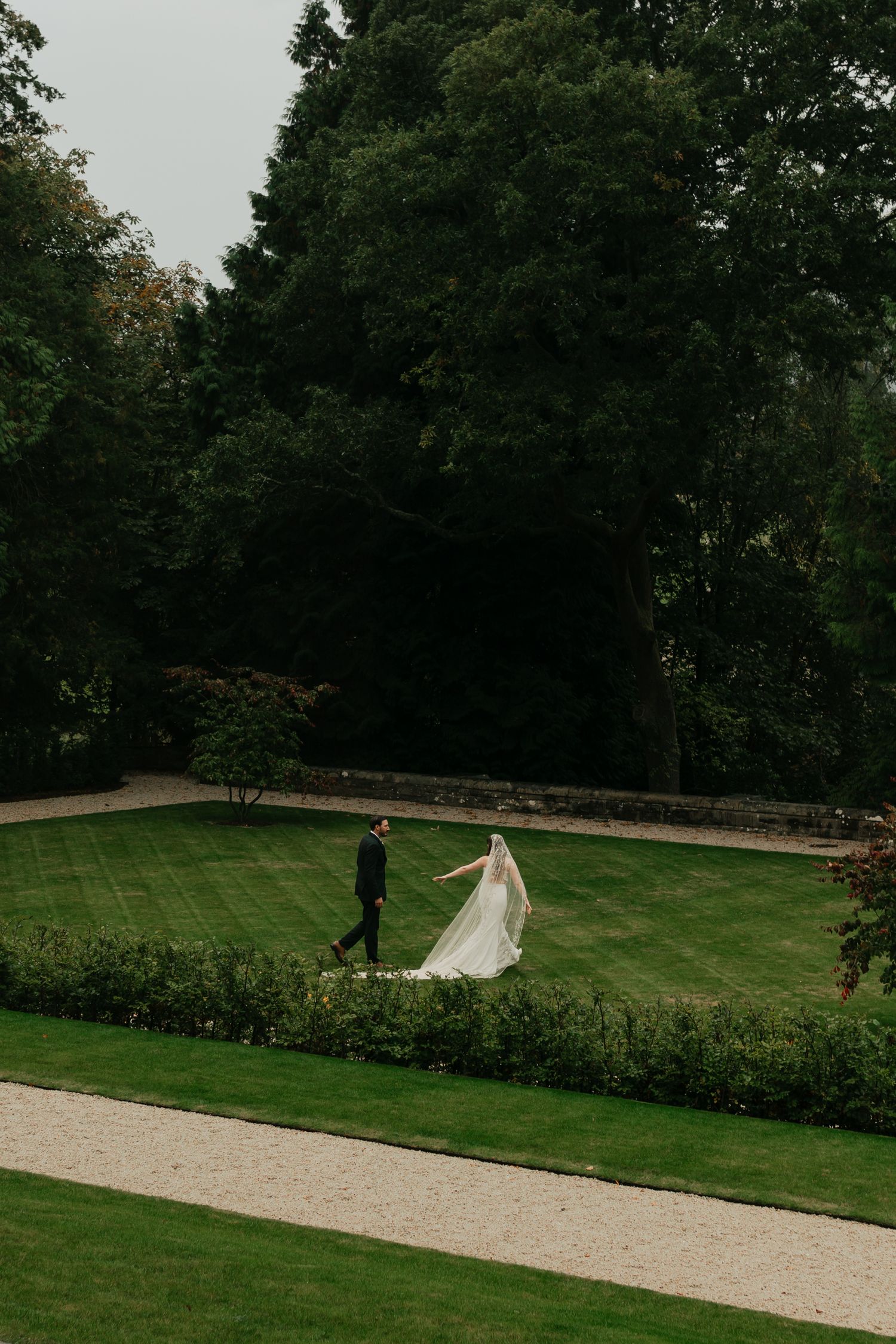 couple walking in a courtyard