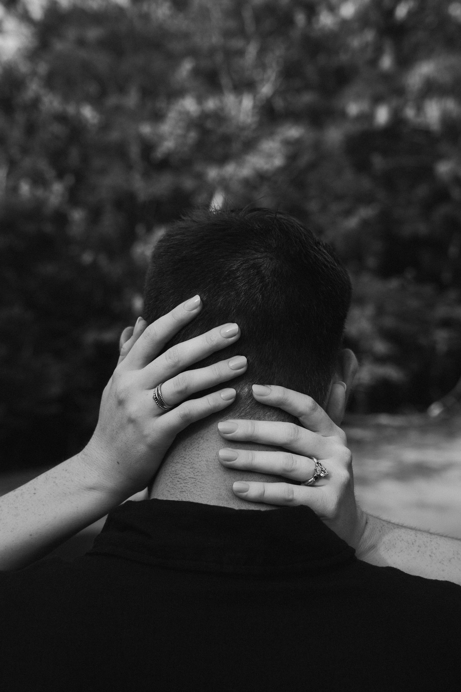 woman holding mans head, picture of just her hands