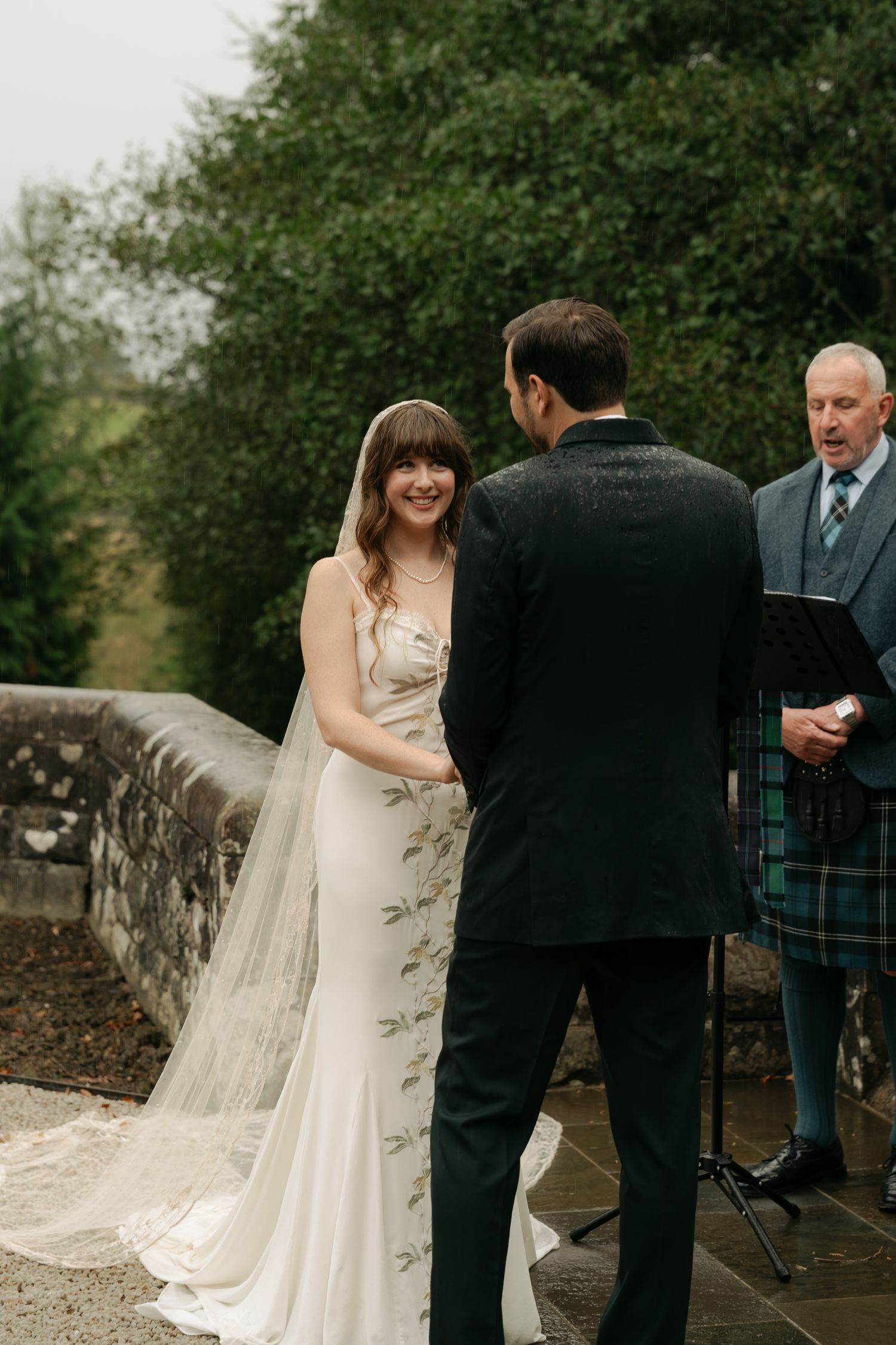 bride and groom during their ceremony, bride smiling