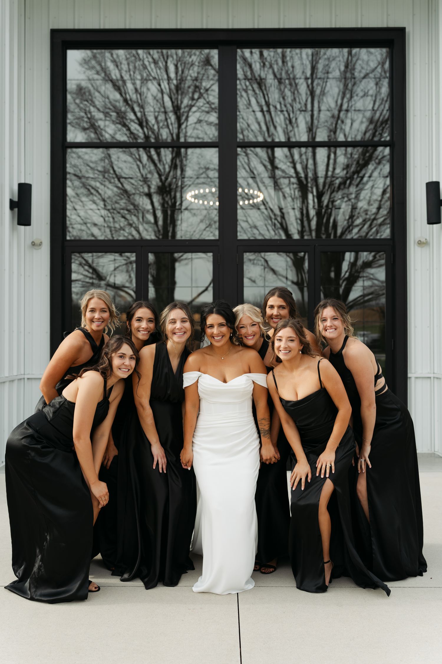 bridesmaid crowded around bride