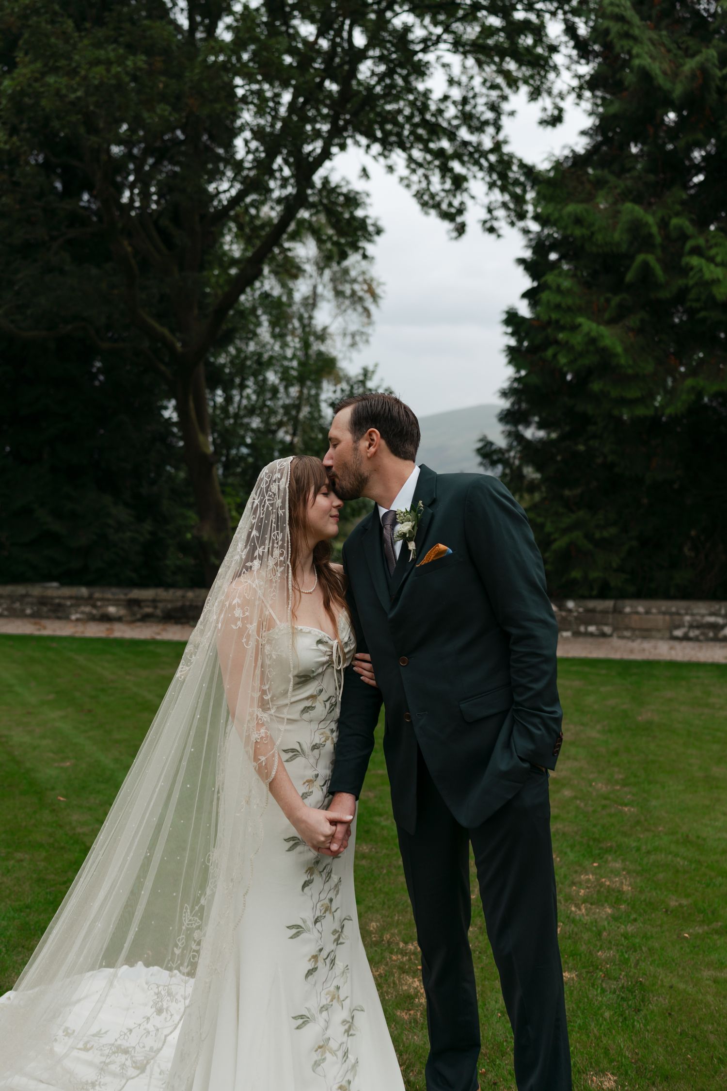 bride and groom standing in a courtyard