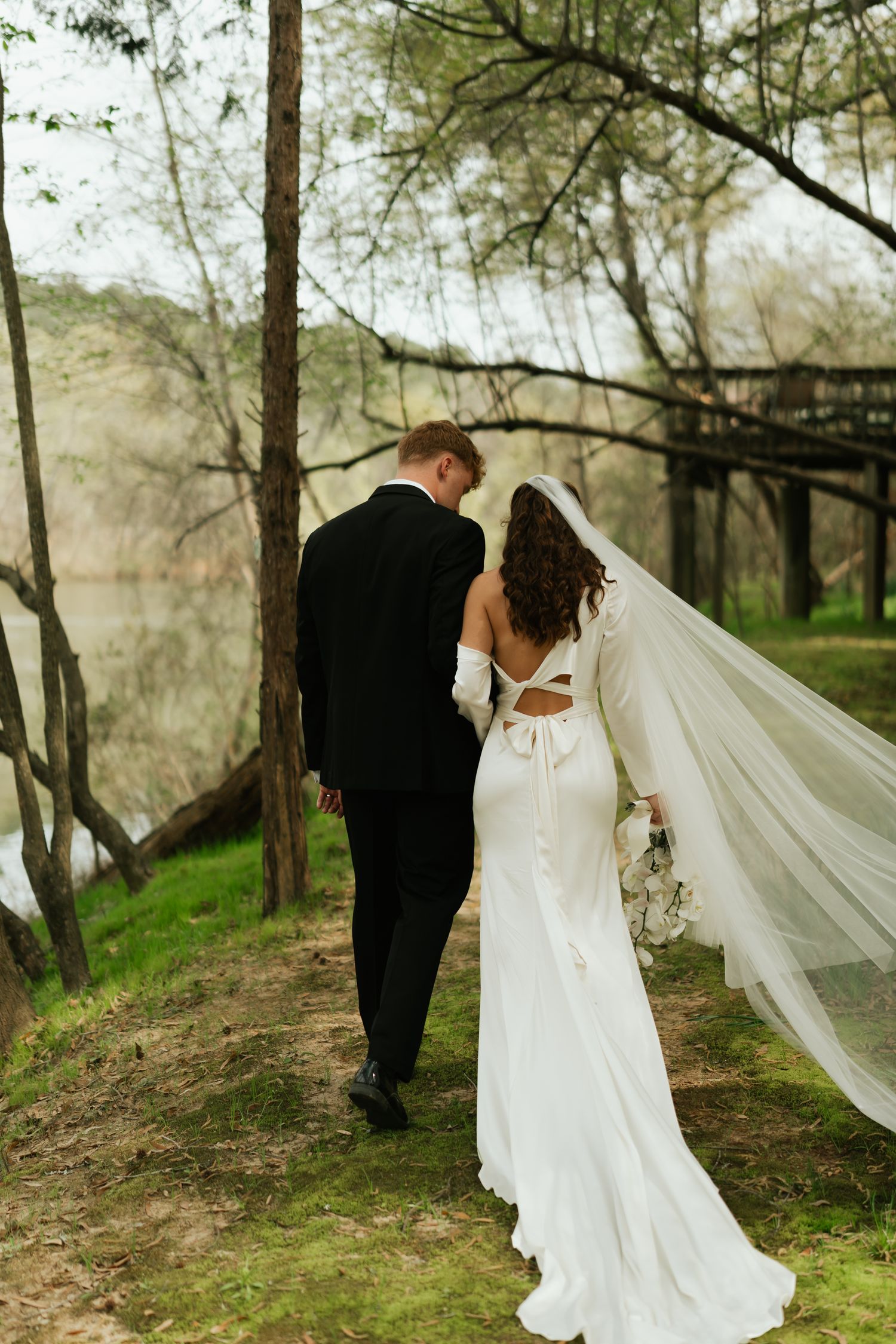 bride and groom, walking away from camera