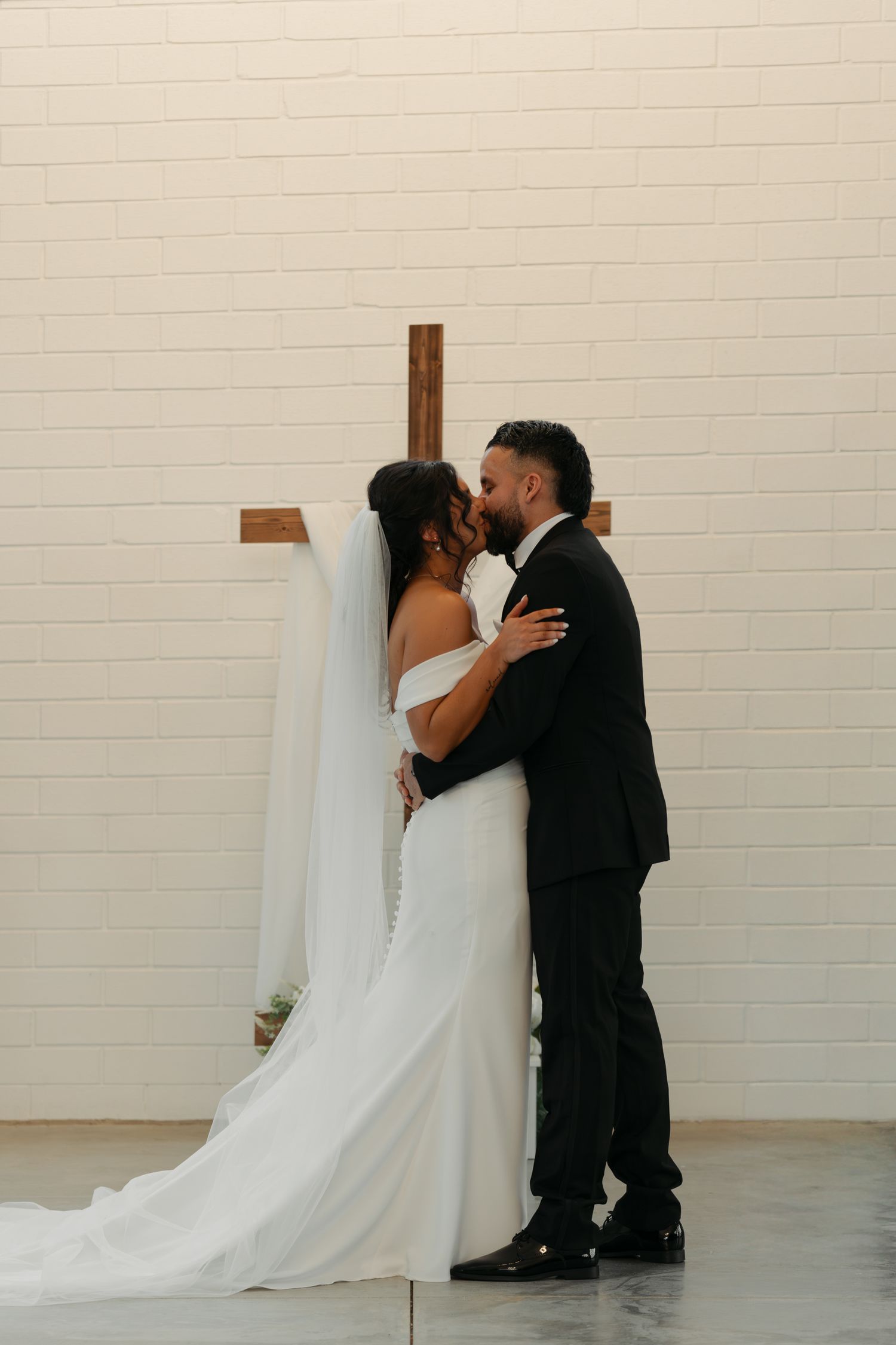 bride and groom kiss