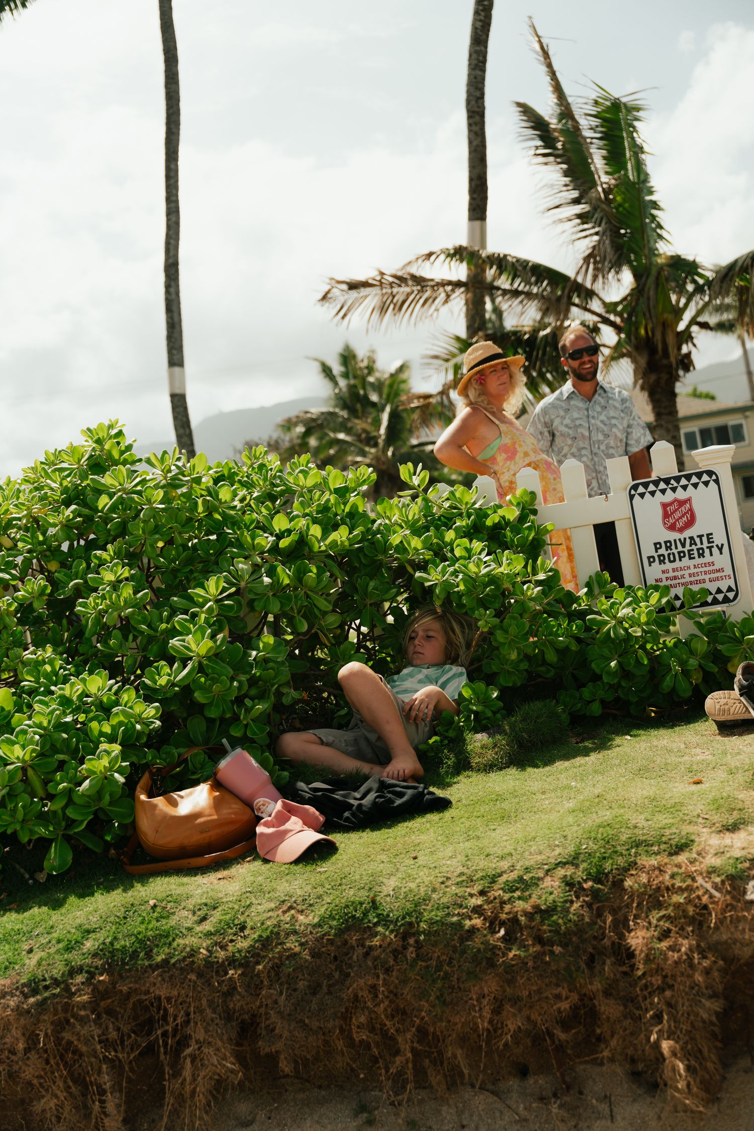 kid sitting in a bush, Kauai