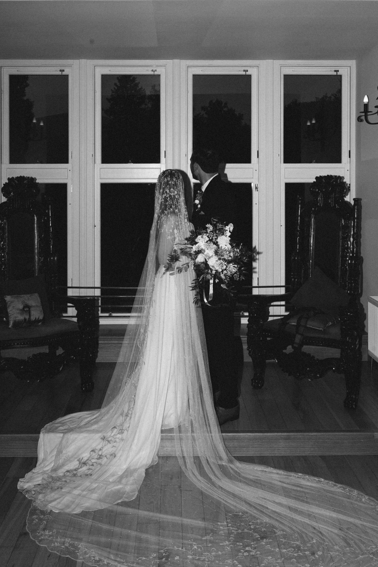 bride and groom looking away from camera