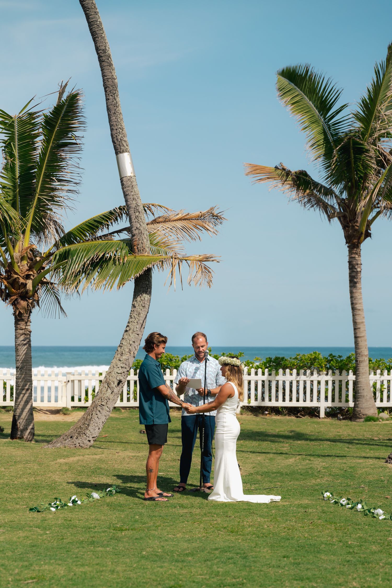 bride and groom standing during ceremony, Oahu, Hawaii