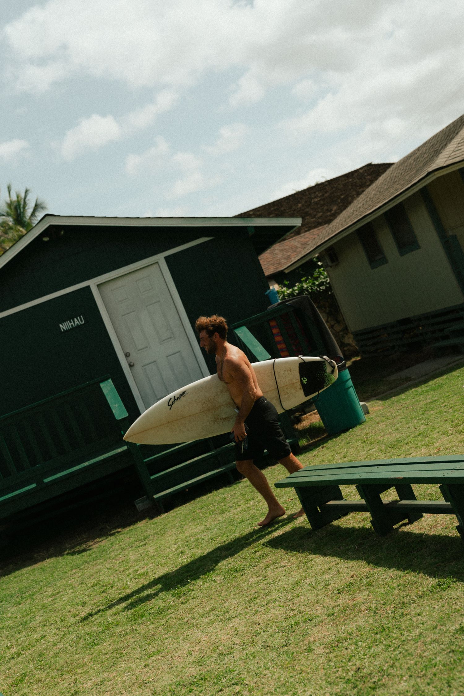 man holding a surfboard, Haleiwa