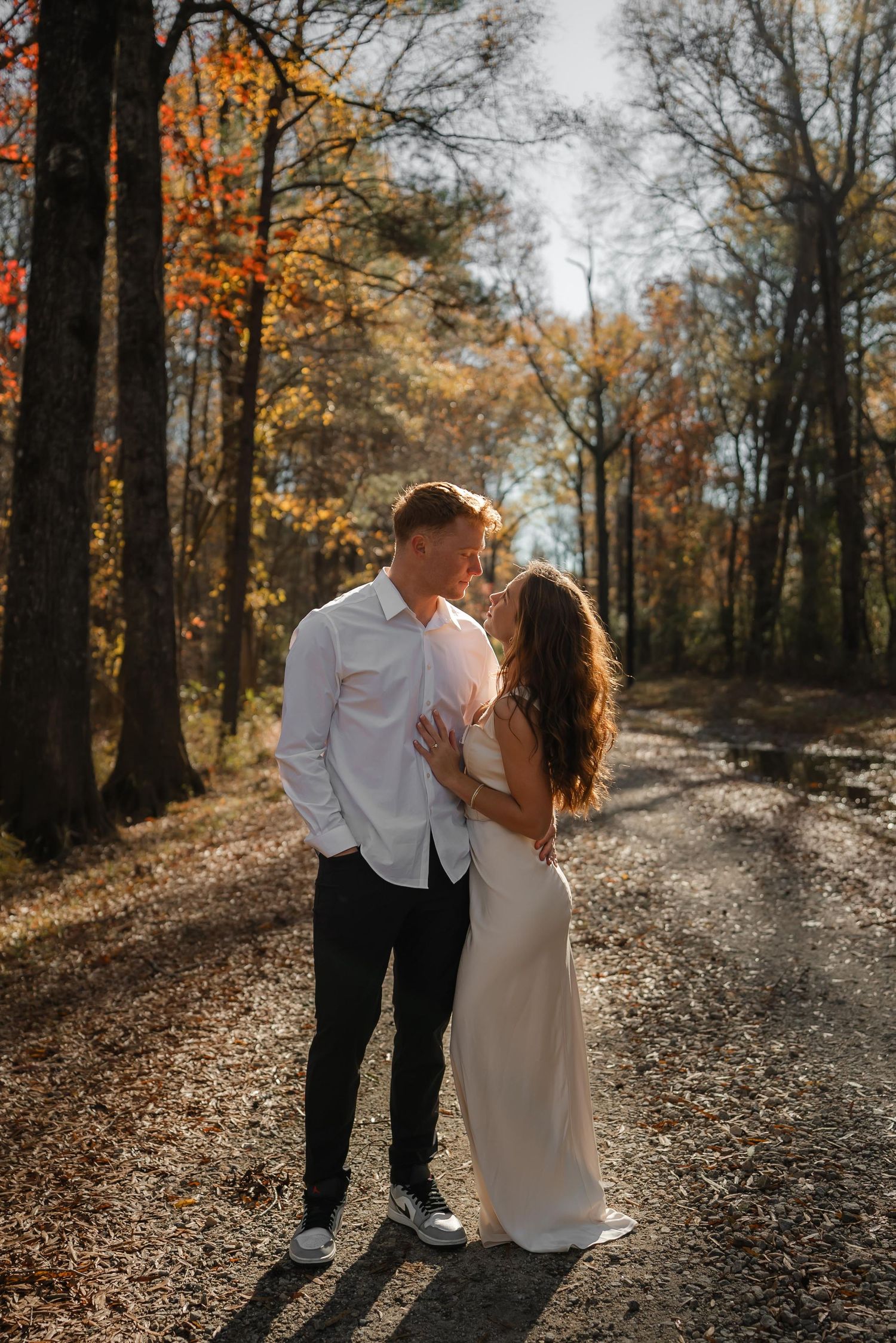 couple portrait standing on dirt road
