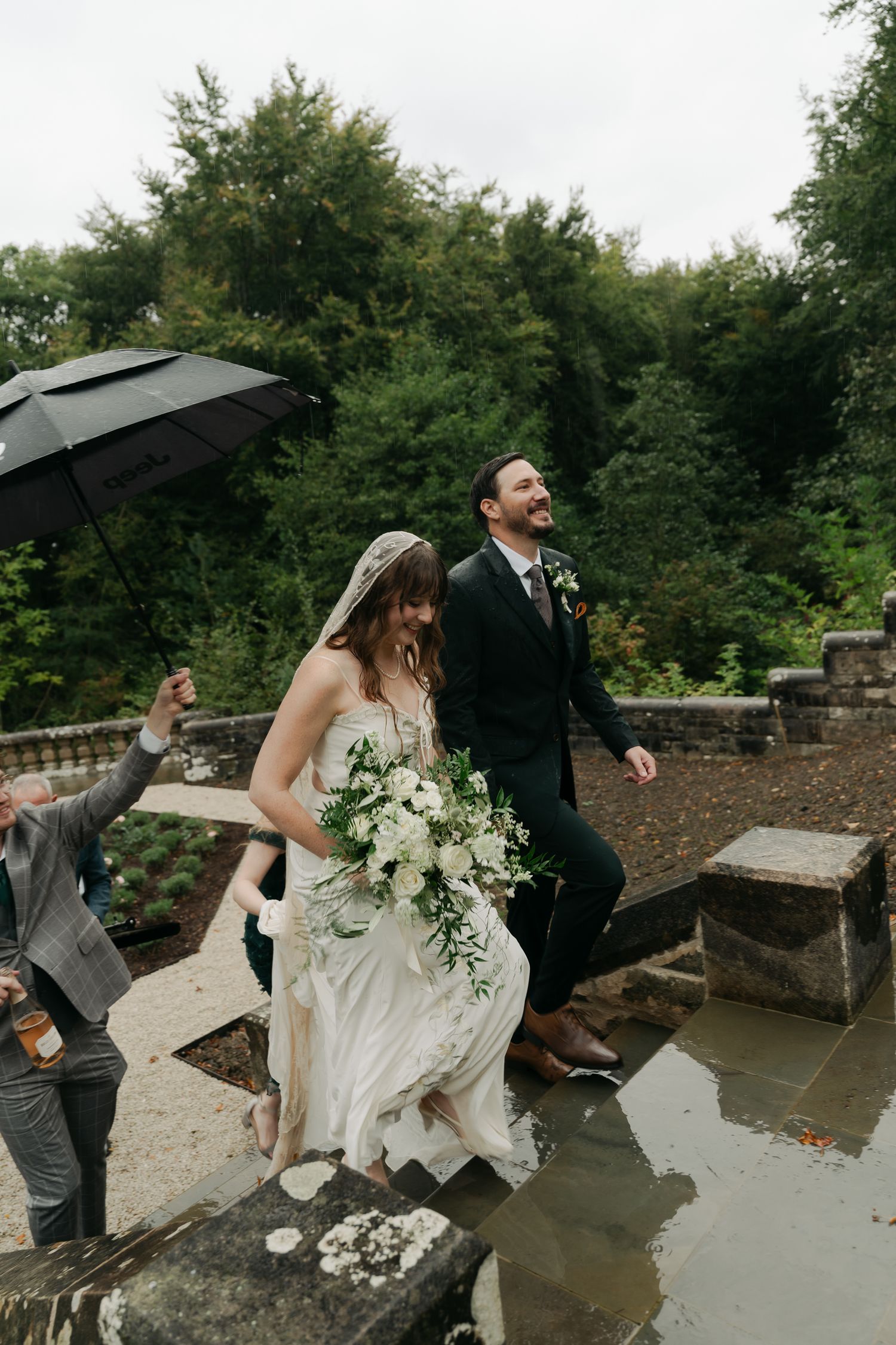 bride and groom walking up stairs