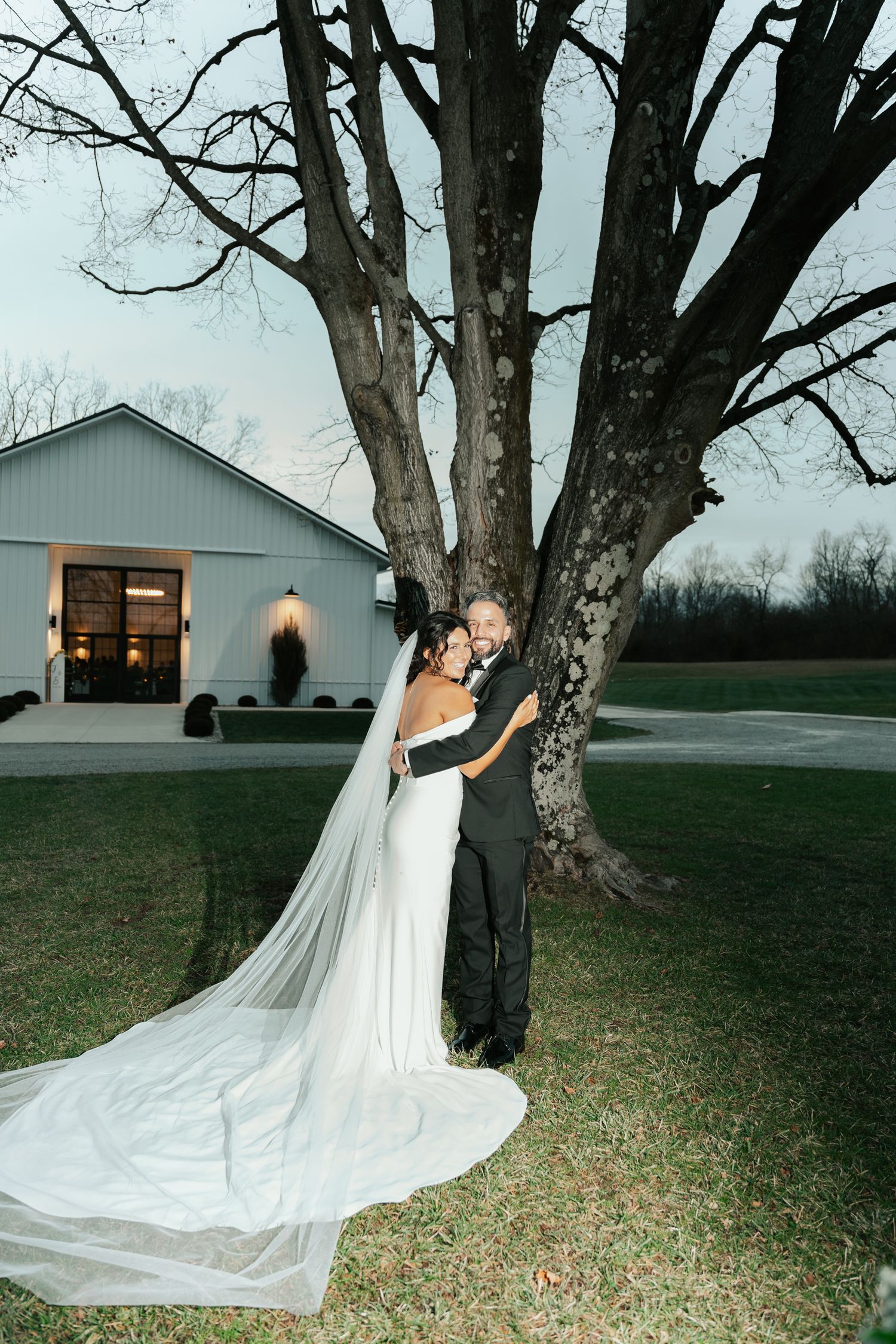bride and groom hugging