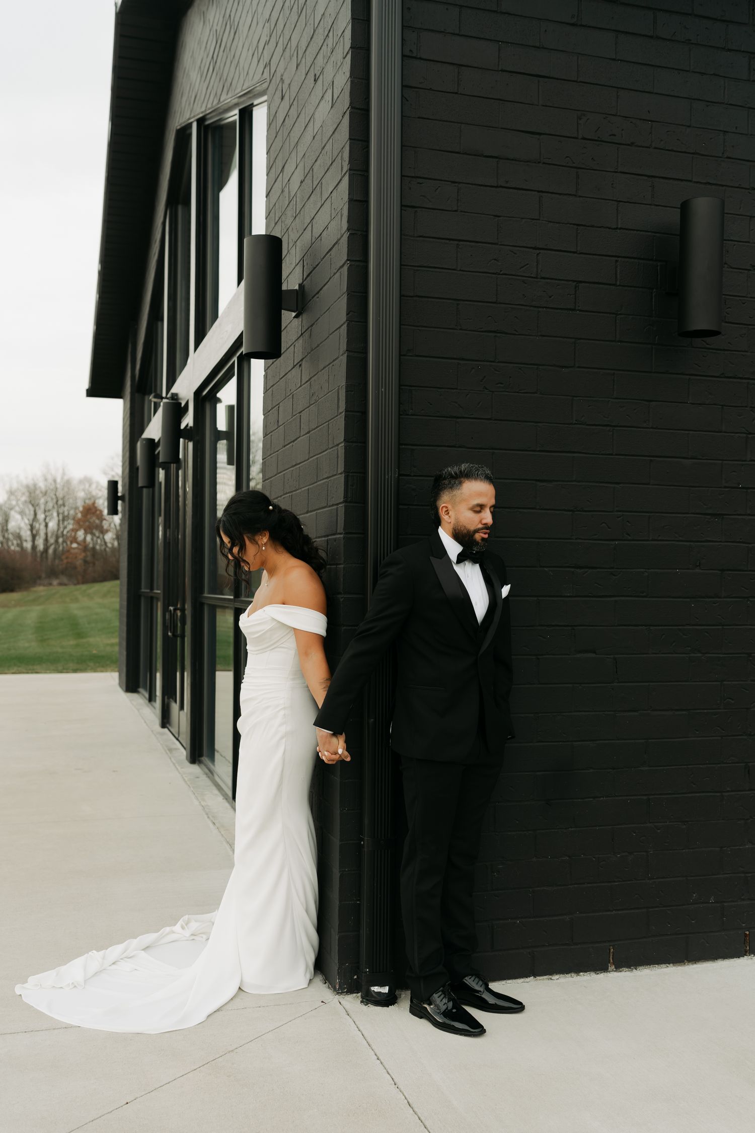 bride and groom holding hands having their first touch