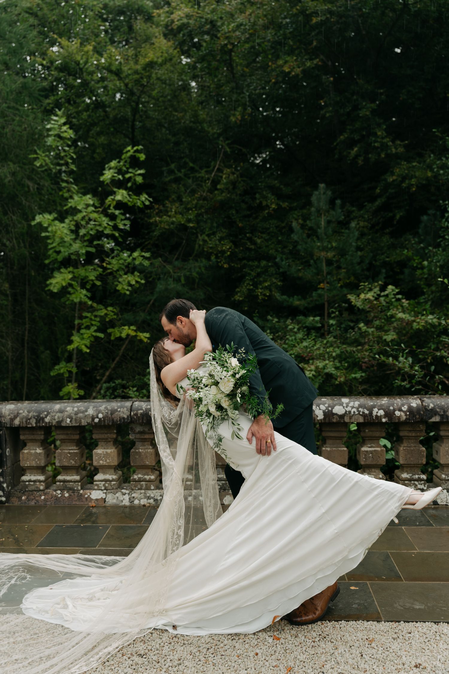 groom dipping his bride