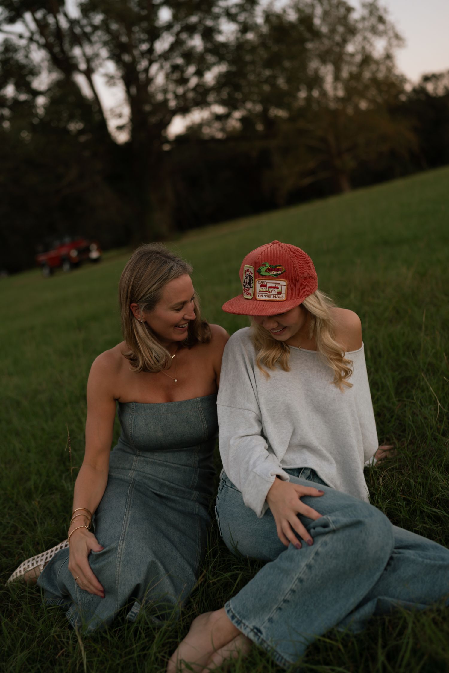 mom and daughter laughing in a field, in Georgia