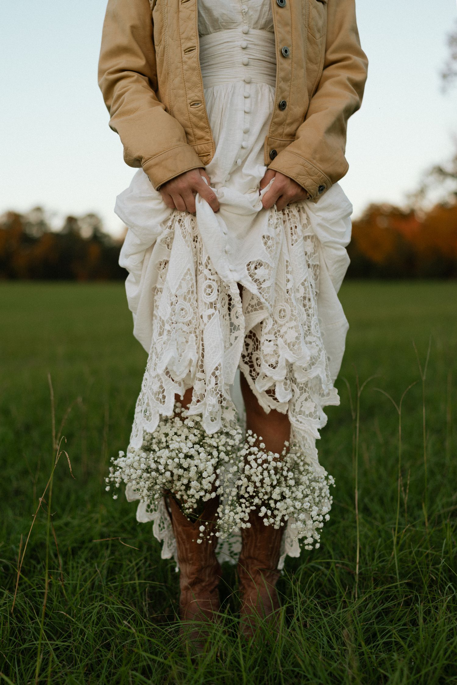 girl with flowers coming out of her cowboy boots
