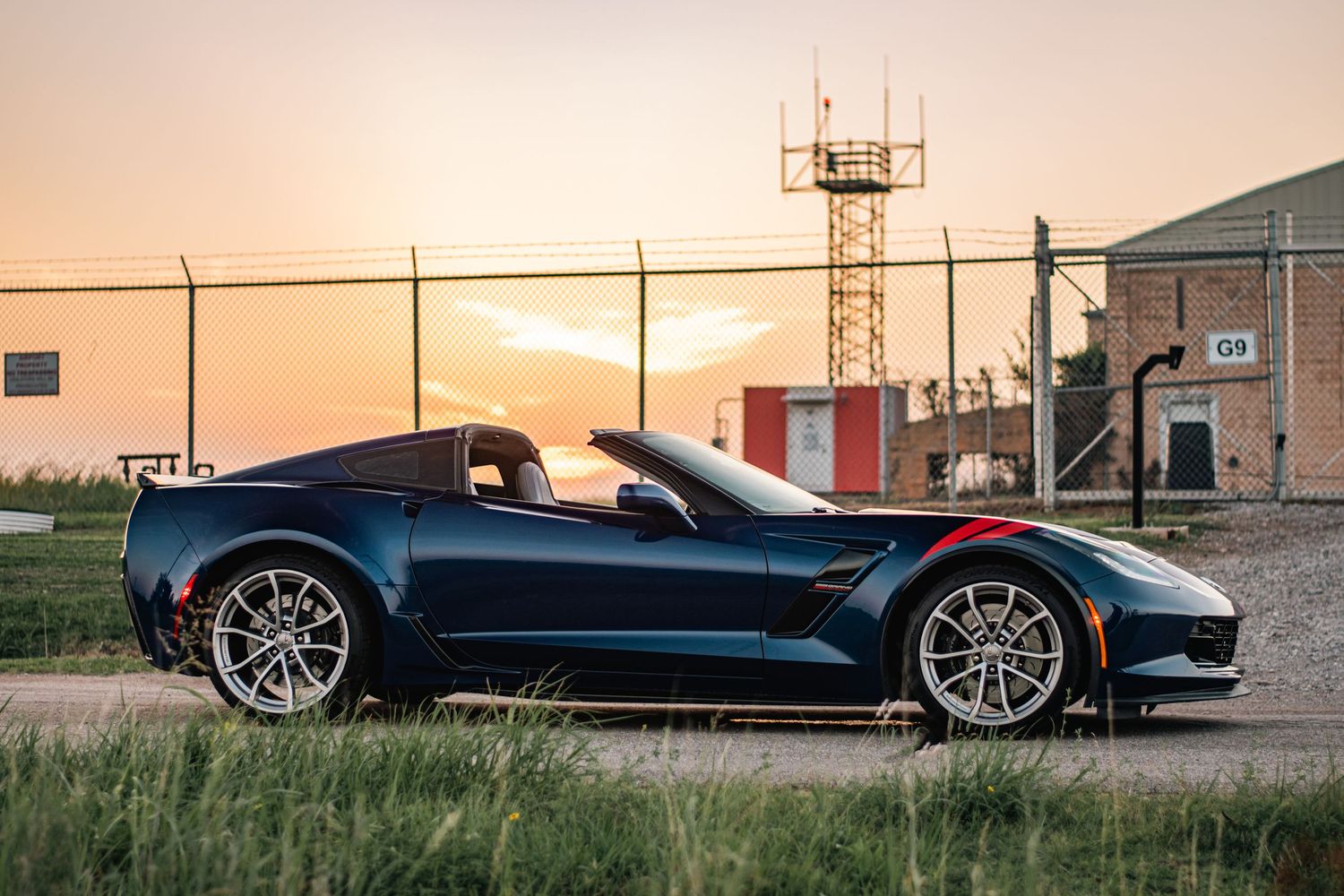 Sleek Chevrolet Corvette photography at sunset, capturing sharp lines, bold styling, and powerful presence in golden hour light.