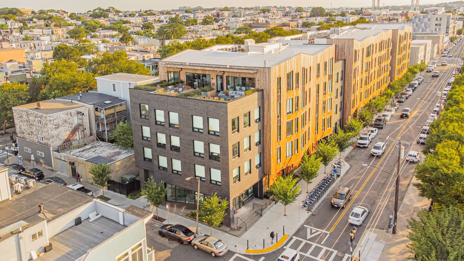 Aerial view of urban neighborhood showing residential buildings and street patterns.