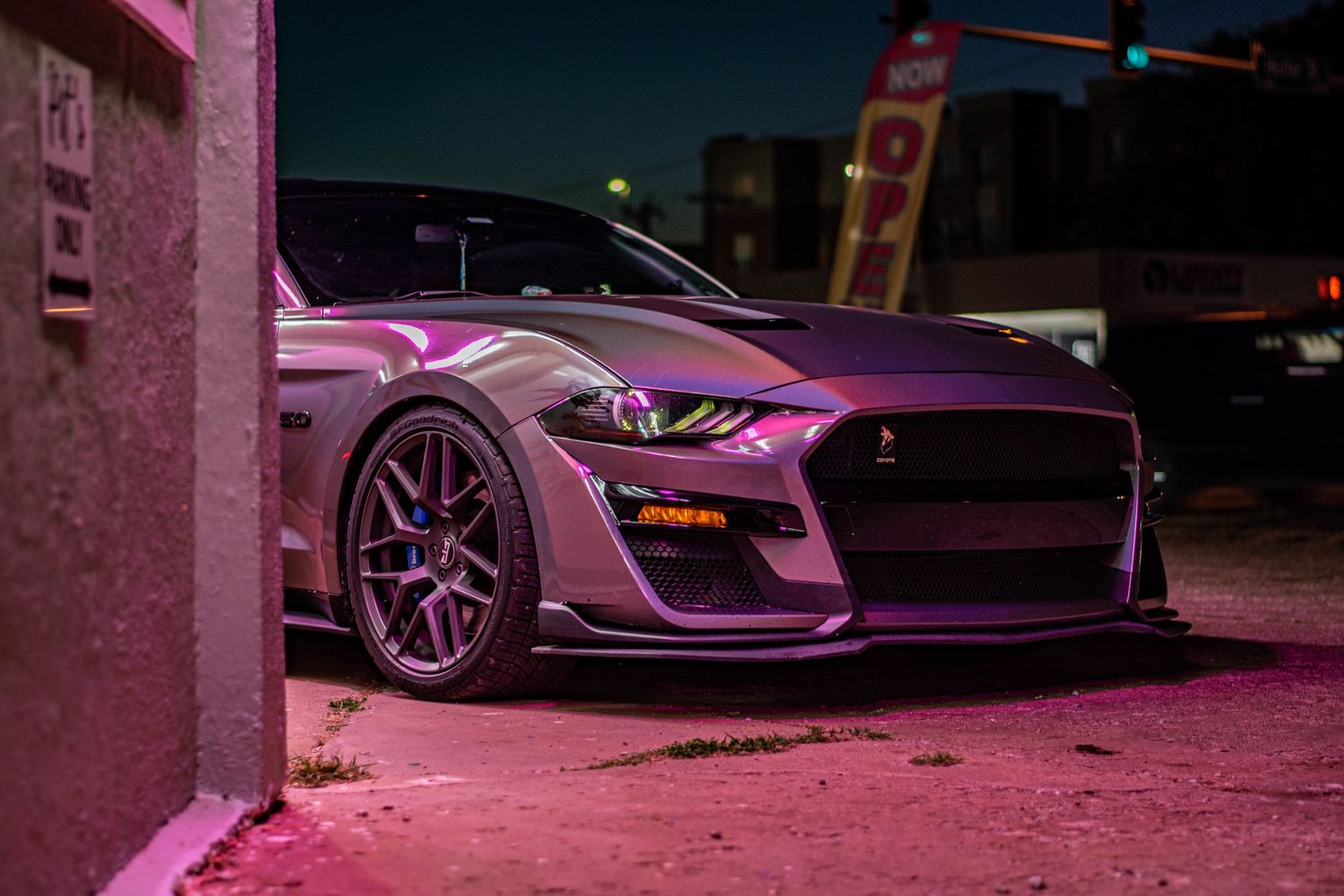 Night automotive photography of a Ford Mustang Shelby, captured with bold lighting, sharp details, and a dramatic street performance vibe.