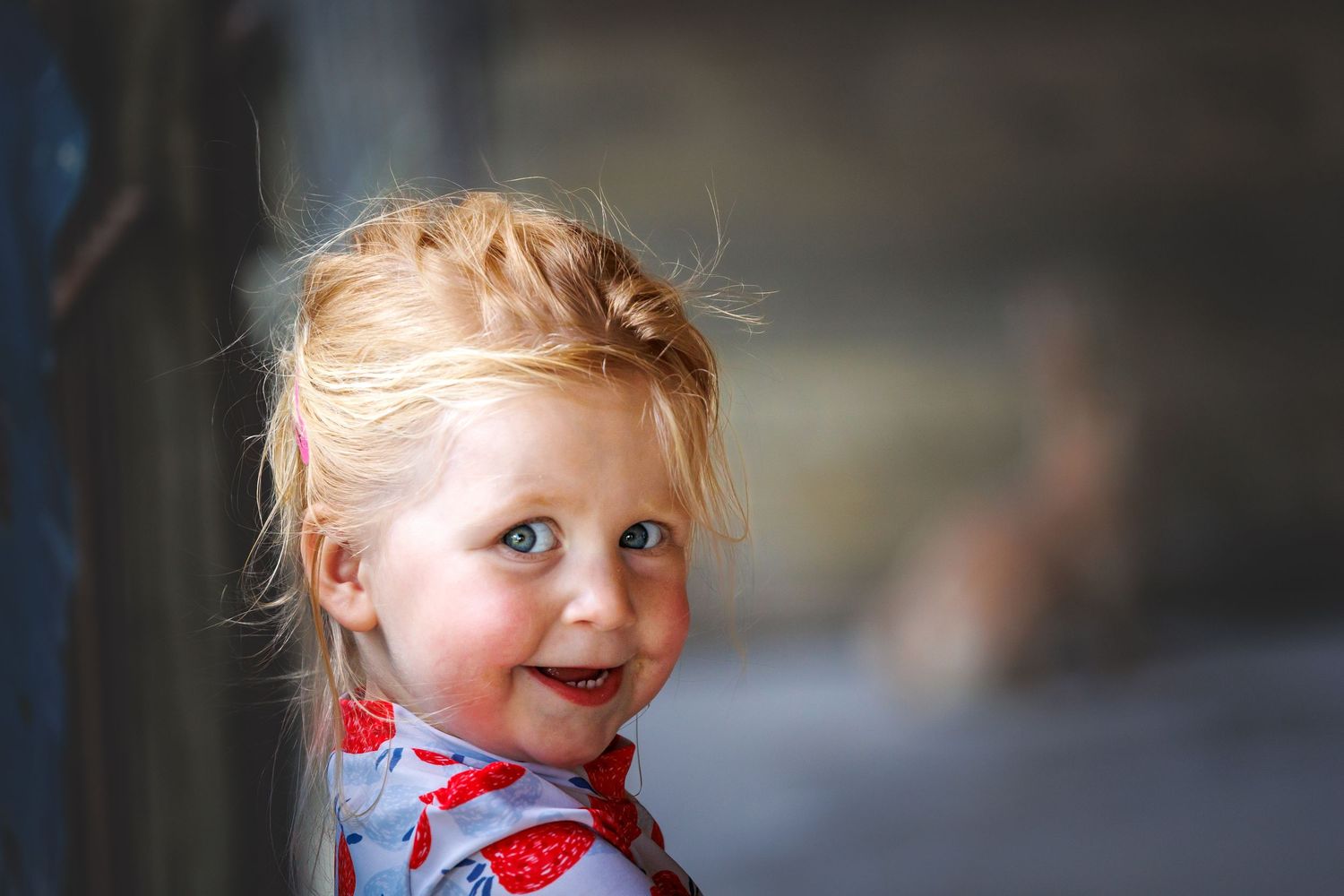 A portrait in natural light with a soft blurred background.