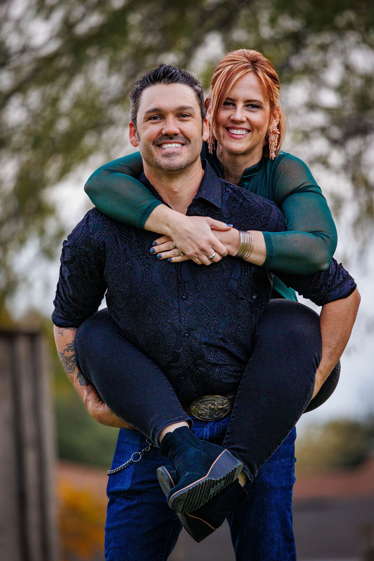 Playful outdoor couples photography session showing piggyback rides and laughter in casual attire.