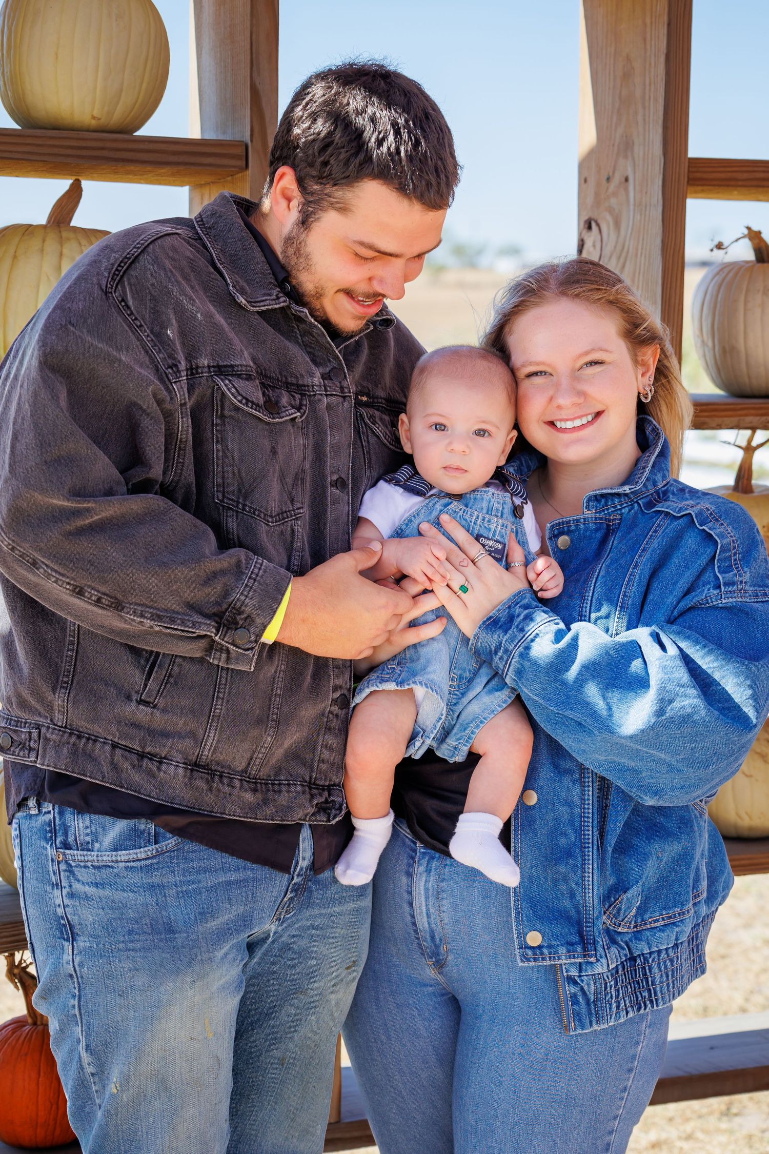 A series of four candid photos showing tender family moments in denim clothing against a light background.